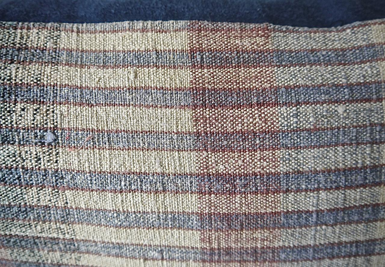 Portugese woven cotton and hemp striped woven cushion made from a 19th century grain sack. Stripes of pale blue, natural white, red with a touch of black. With 19th century French tassels at each corner. Backed in a dyed 19th century French linen