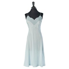 Pale blue silk slip dress with flower appliqué Circa 1930
s Pale blue silk slip dress with flower appliqué Circa 1930
s