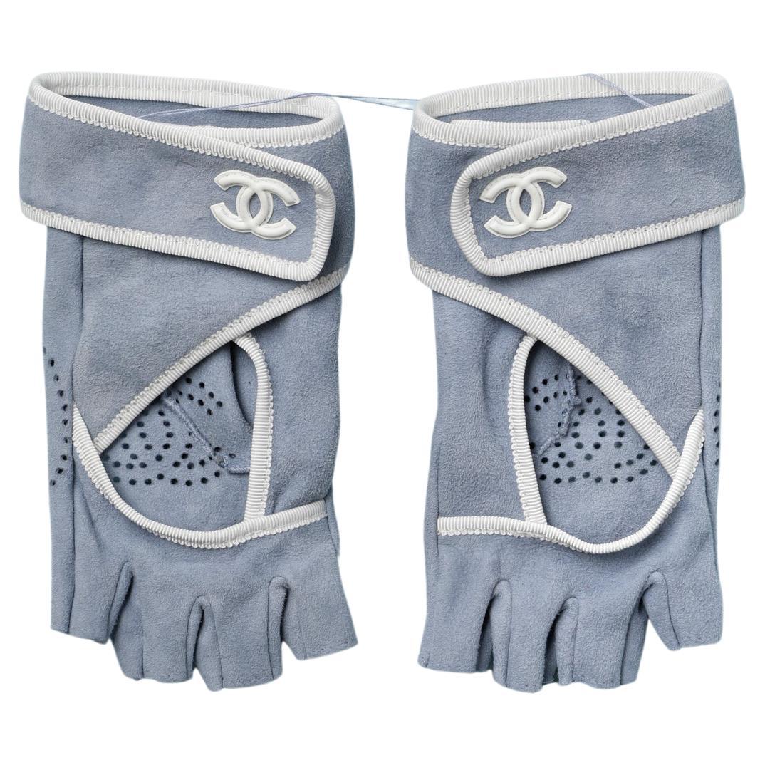 Pale blue suede mittens with white gros-grain piping and "double C" Chanel 