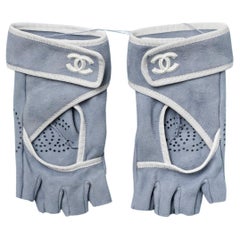 Pale blue suede mittens with white gros-grain piping and "double C" Chanel 
