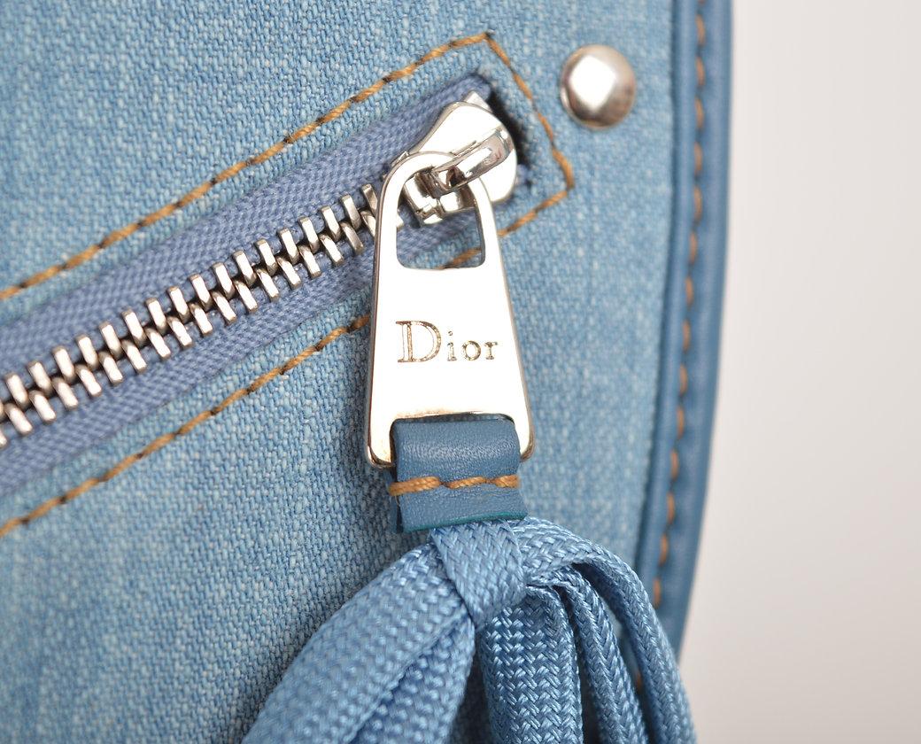 Beautiful 2000'S Christian Dior designed by John Galliano 'Admit It' Bag.

Features;
Lace up, Corseted ribbons
Large exterior 'Dior' metal hardware buckle
Light blue denim fabric
Adjustable shoulder strap
x3 Interior compartments, with x1 small zip