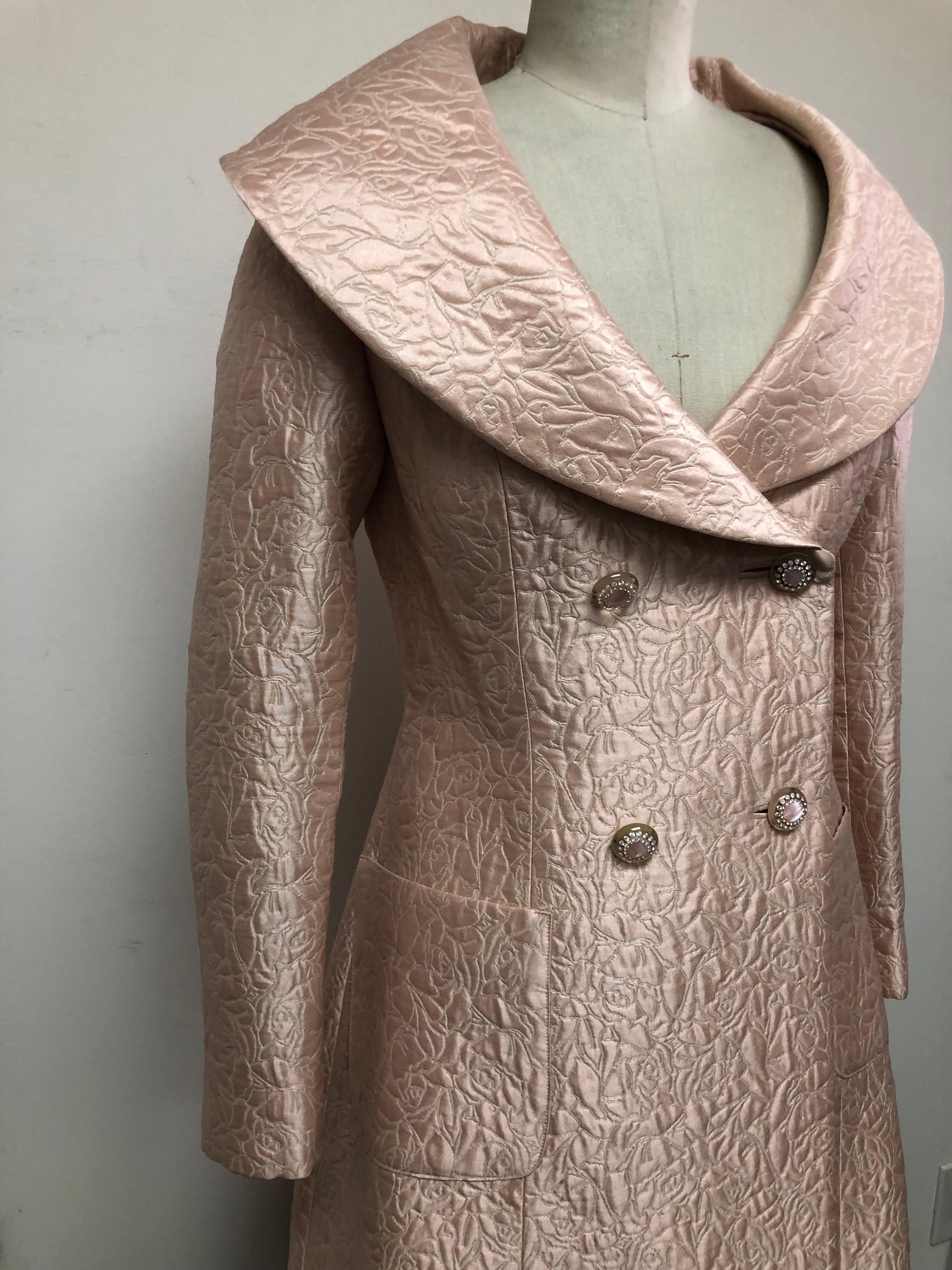 Blush Pink Fit and Flare Portrait Collar Coat in the finest Swiss Silk Matelasse with Diamonte Buttons. Perfect for day into evening as a wedding guest, for luncheon parties or cocktails. Pairs perfectly with black or white.
For your convenience the