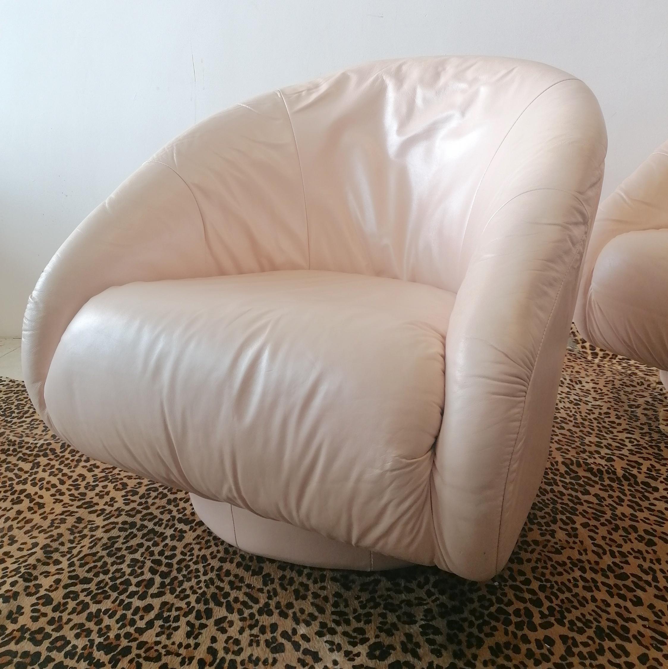 This chair epitomises the crazy 1980s style period that we love: Pale pink pearlised leather, plouffy comfort, and it swivels.
By Natuzzi, Italy.
Leather is buttery soft and has a nice vintage feel.


Dimensions: width 75cm, depth 78cm, height 76cm,