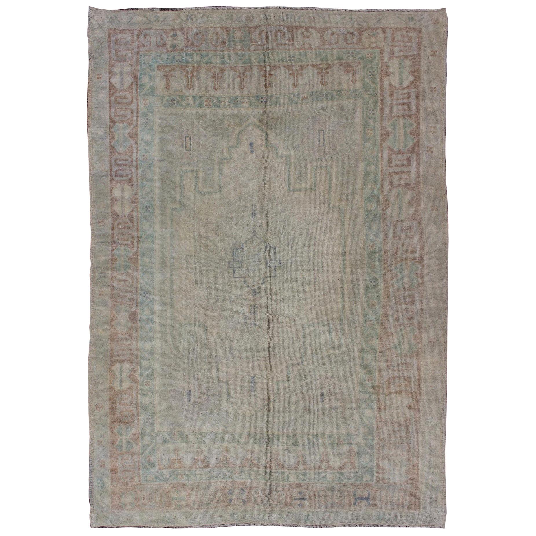 Pale Color Turkish Oushak Rug with Geometric Motifs in Light Brown, Tan & Green For Sale