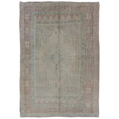 Vintage Pale Color Turkish Oushak Rug with Geometric Motifs in Light Brown, Tan & Green