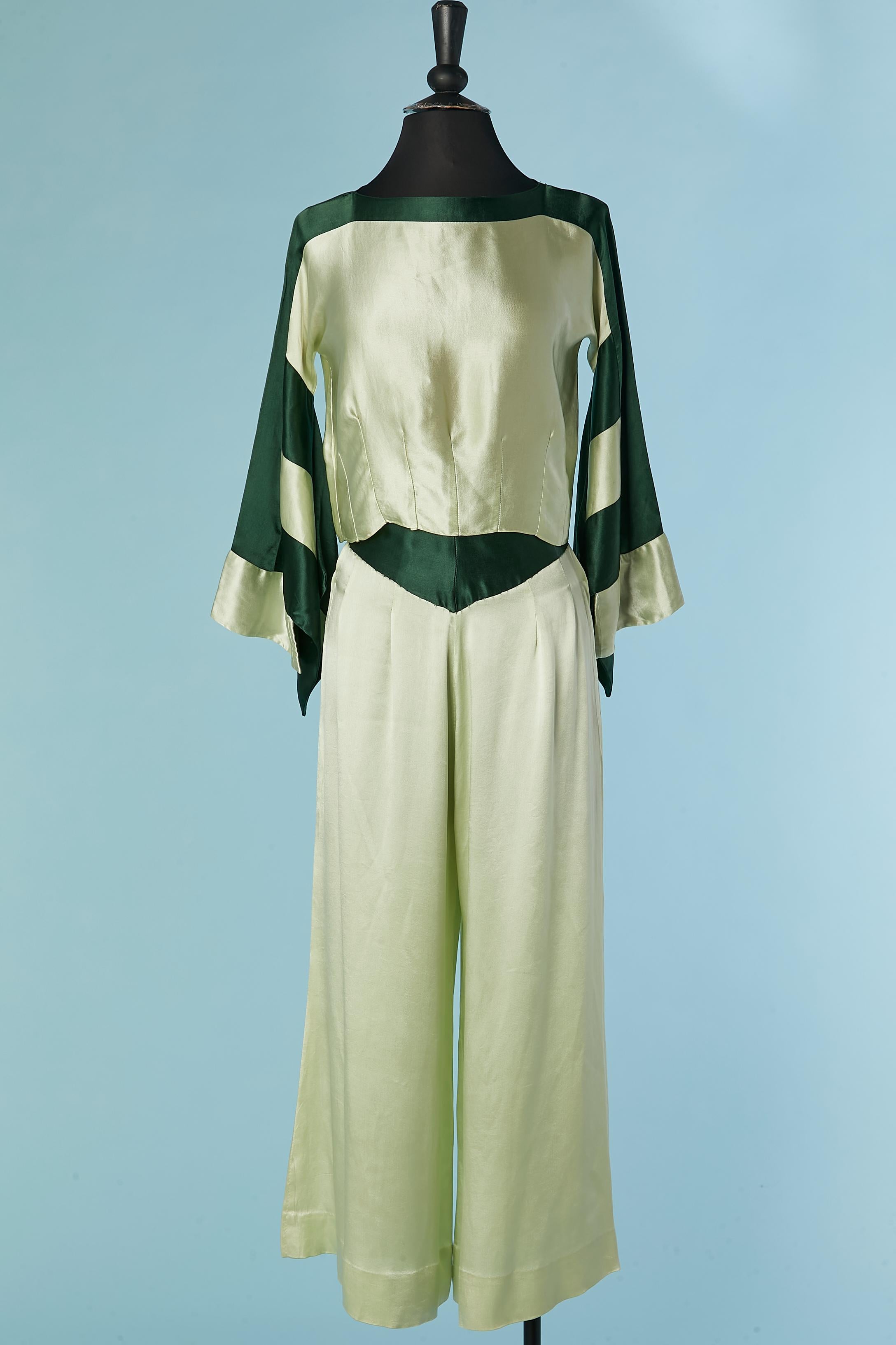 Pale green and forest green silk satin pyjamas. Cut-work sleeves, kimono inspiration. 
The trouser is close on both side with hook&eye + fabric belt.
SIZE S 