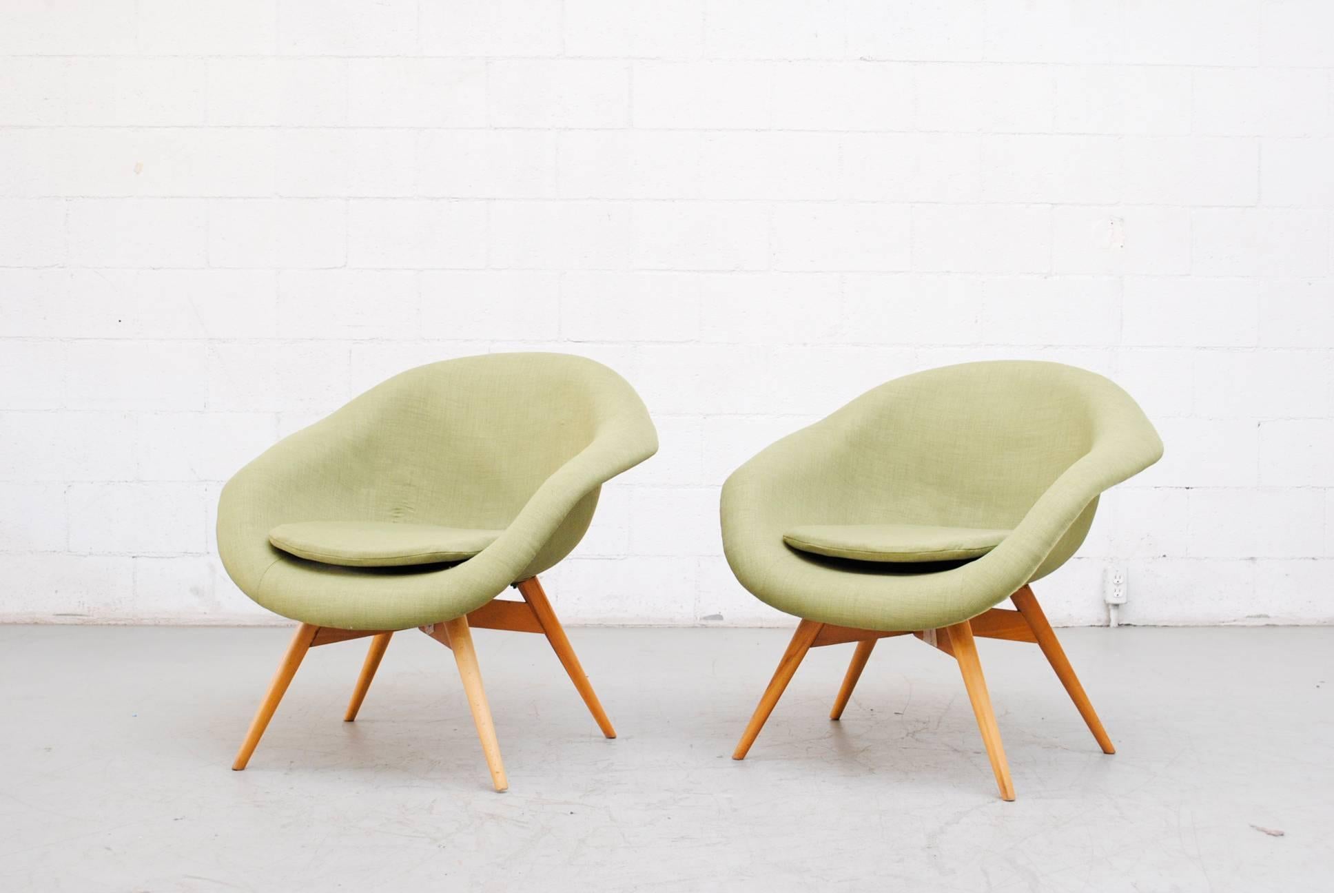 Newly upholstered pale green bucket chairs by Miroslav Navratil. Frames are in good original condition with visible wear to frame. Others available in assorted color colors. (Two available).