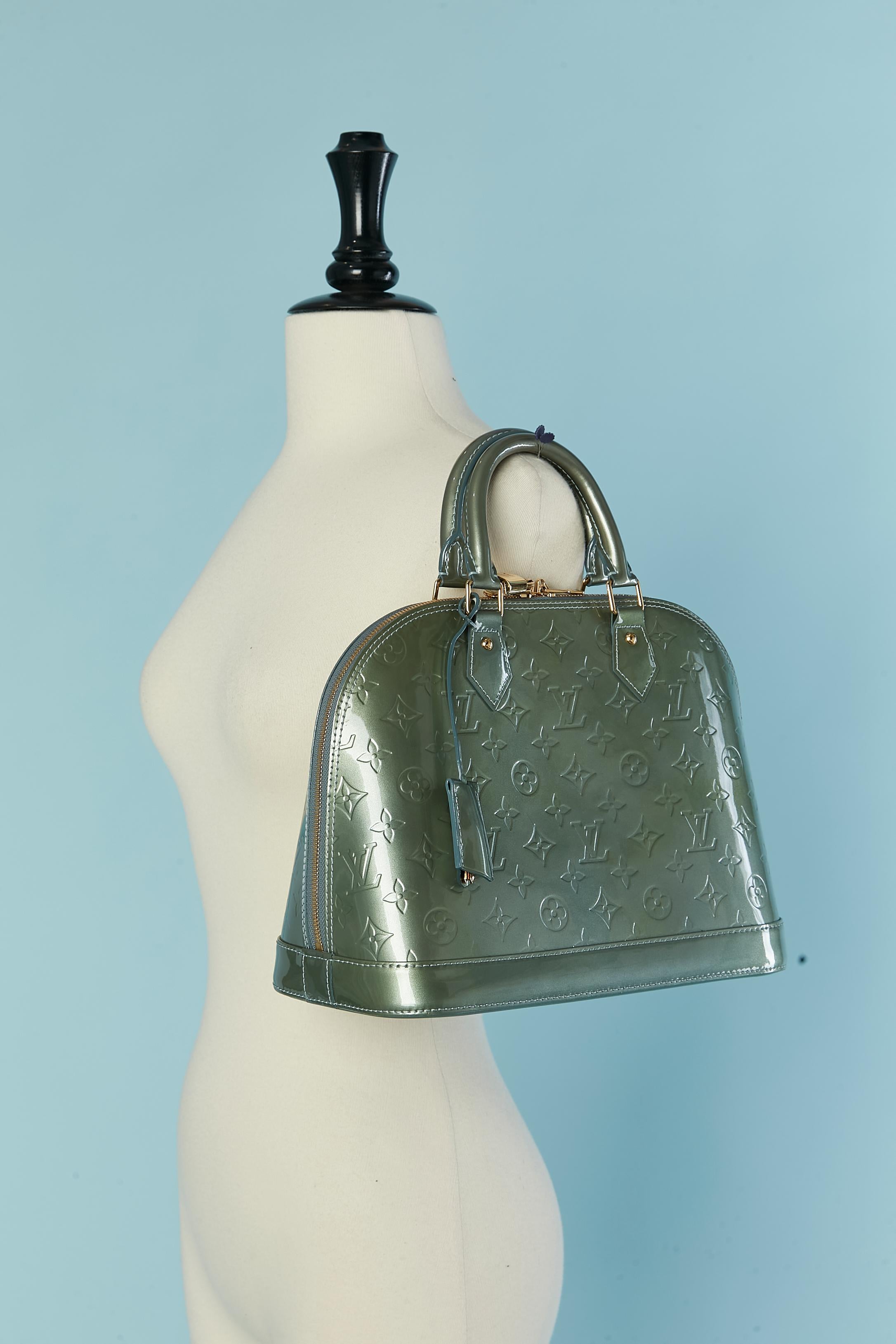 Women's or Men's Pale green leather top handle bag with Monogram Louis Vuitton For Sale