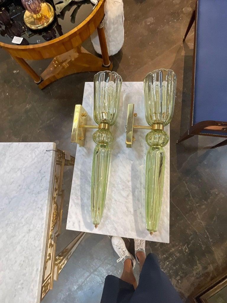 Gorgeous pair of pale green Murano glass and brass sconces by Seguso. Featuring glistening glass and nice scale and shape. Would work in a variety of decors. Creates a beautiful decorative touch!