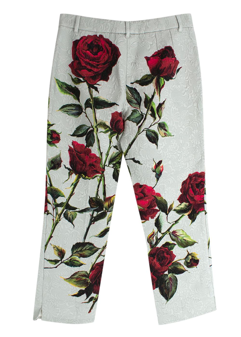 Dolce & Gabbana pale green rose printed brocade trousers

- Pale green floral brocade trousers with a deep red roses print across the front and back
- Slim leg, tailored shape 
- Flat front, zip fly
- Silk cotton lining 

Materials 
54% Cotton 
34%