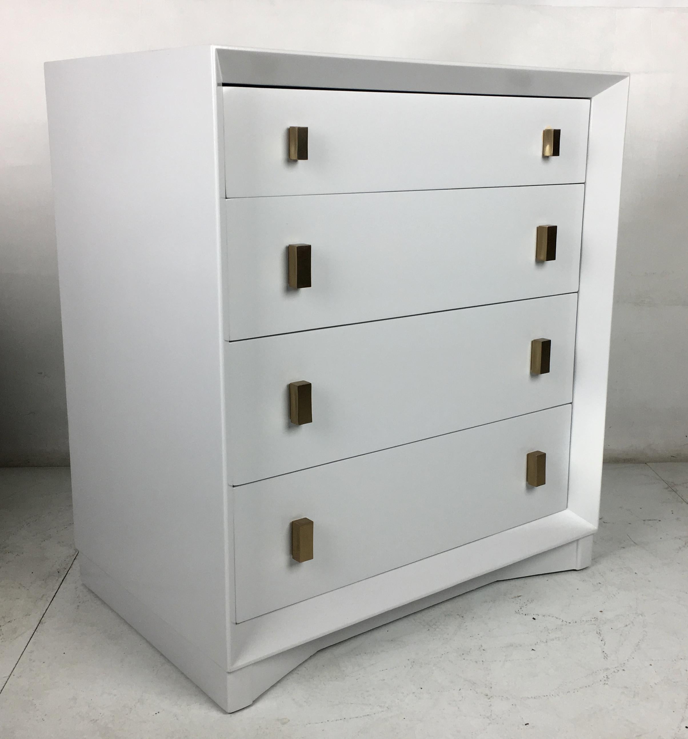 Handsome pale grey commode/chest of drawers by Plymouth Furniture for John Stuart NY. The chest has been meticulously restored and freshly lacquered in a grey/off-white.