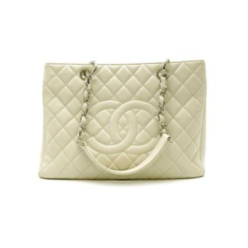 Chanel Mint Green Caviar Leather Quilted Grand Shopping Tote 
 
 
 
 - Mint Green diamond quilted caviar leather body
 
 - Leather threaded, polished silver tone chain-link shoulder straps
 
 - Prominent quilted Chanel CC logo
 
 - Light taupe