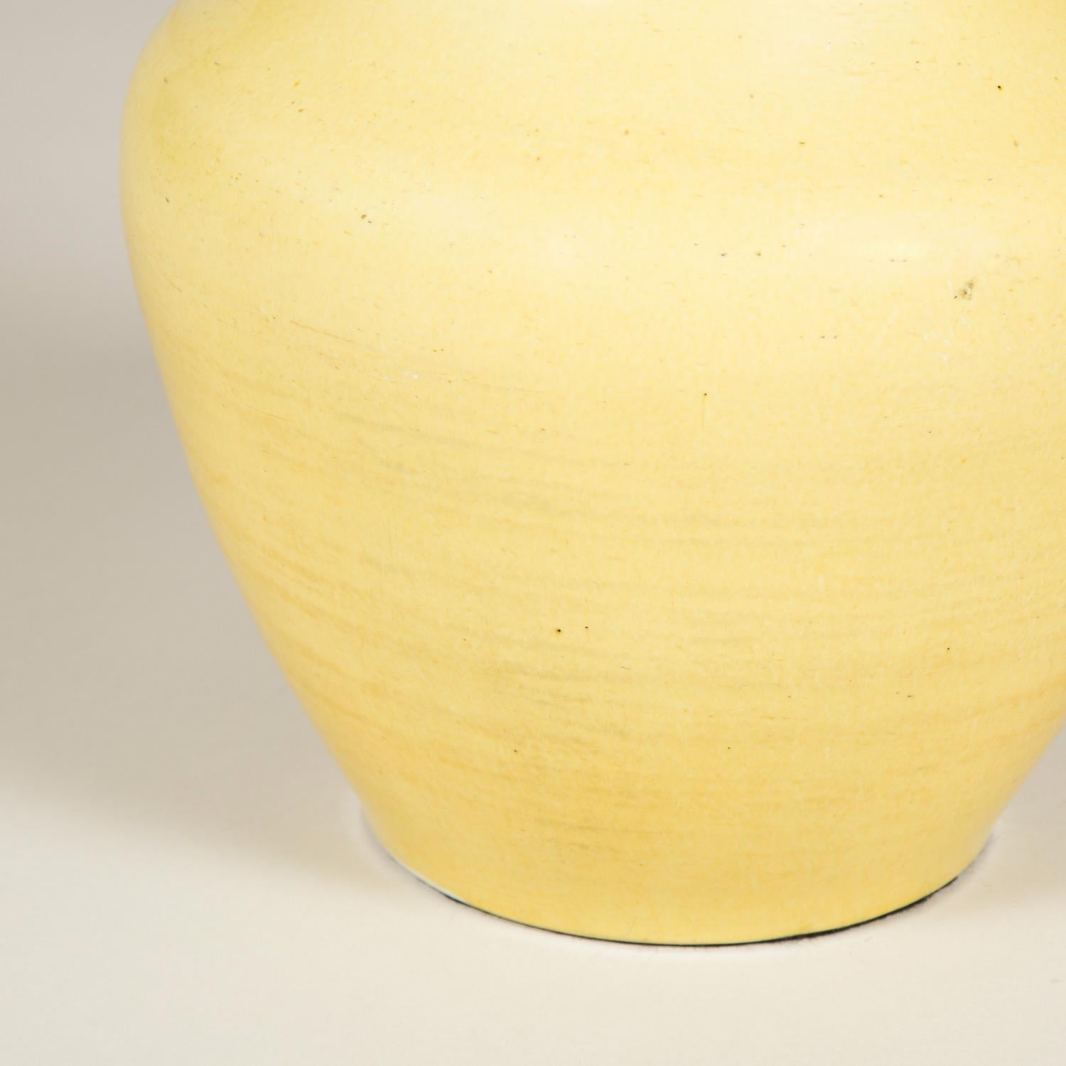 A pale mustard yellow Chinese vase, circa 1800. Wired as a lamp.