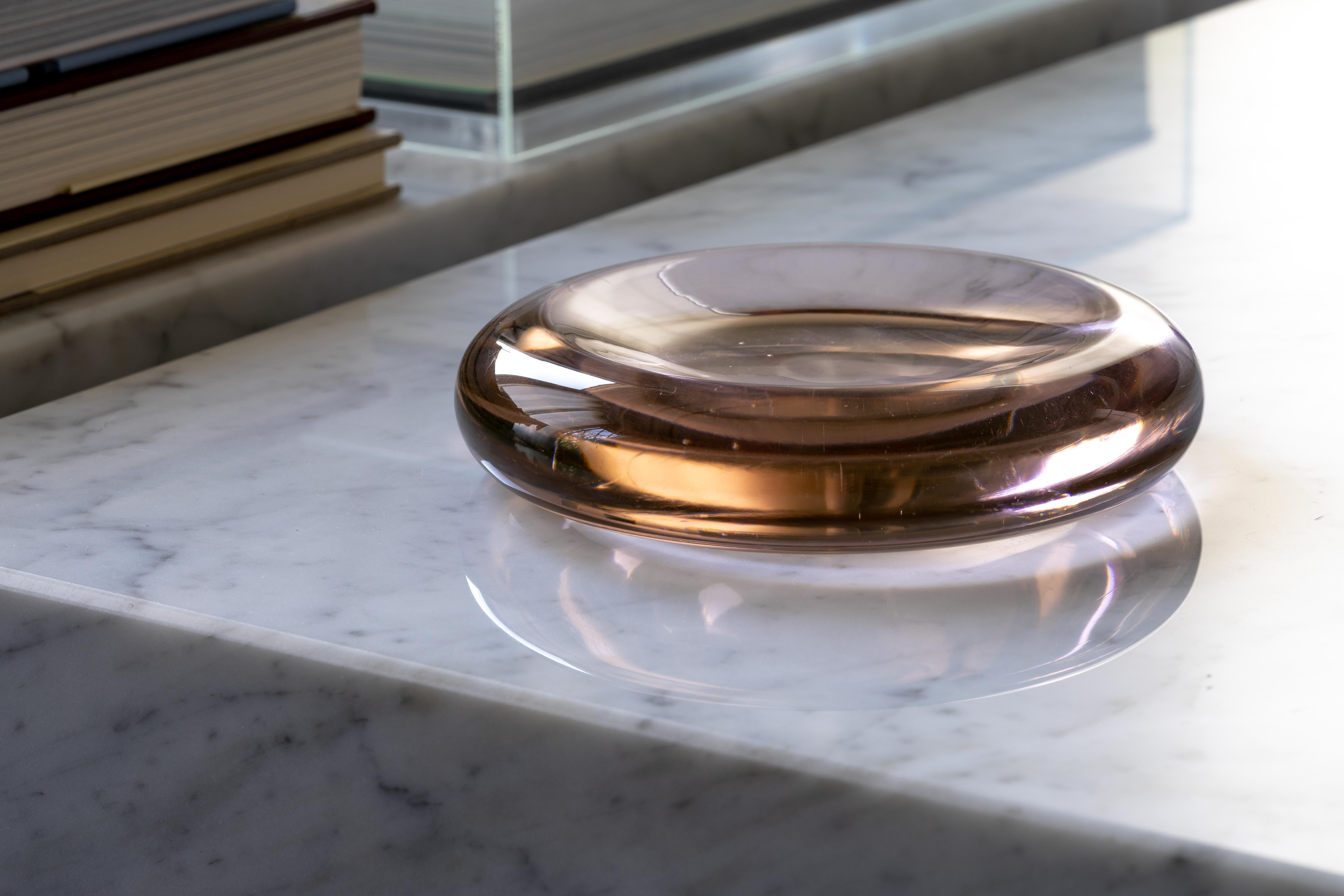 A lovely pale pink or blush-colored blown glass dish by Salviati & Co. from the mid-1980s. Typical of American designer Charles Pfister's work with the Murano-based firm, the smooth, polished dish resembles an oversized lozenge that appears to glow