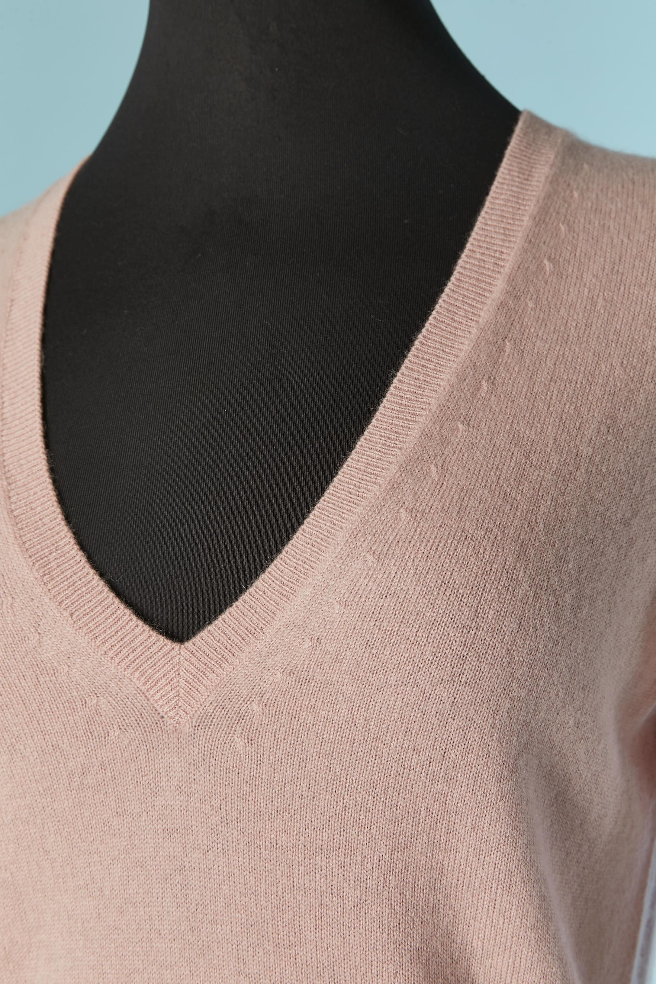 Pale pink cashmere sweater with V neck . 
New with tag.
SIZE S 