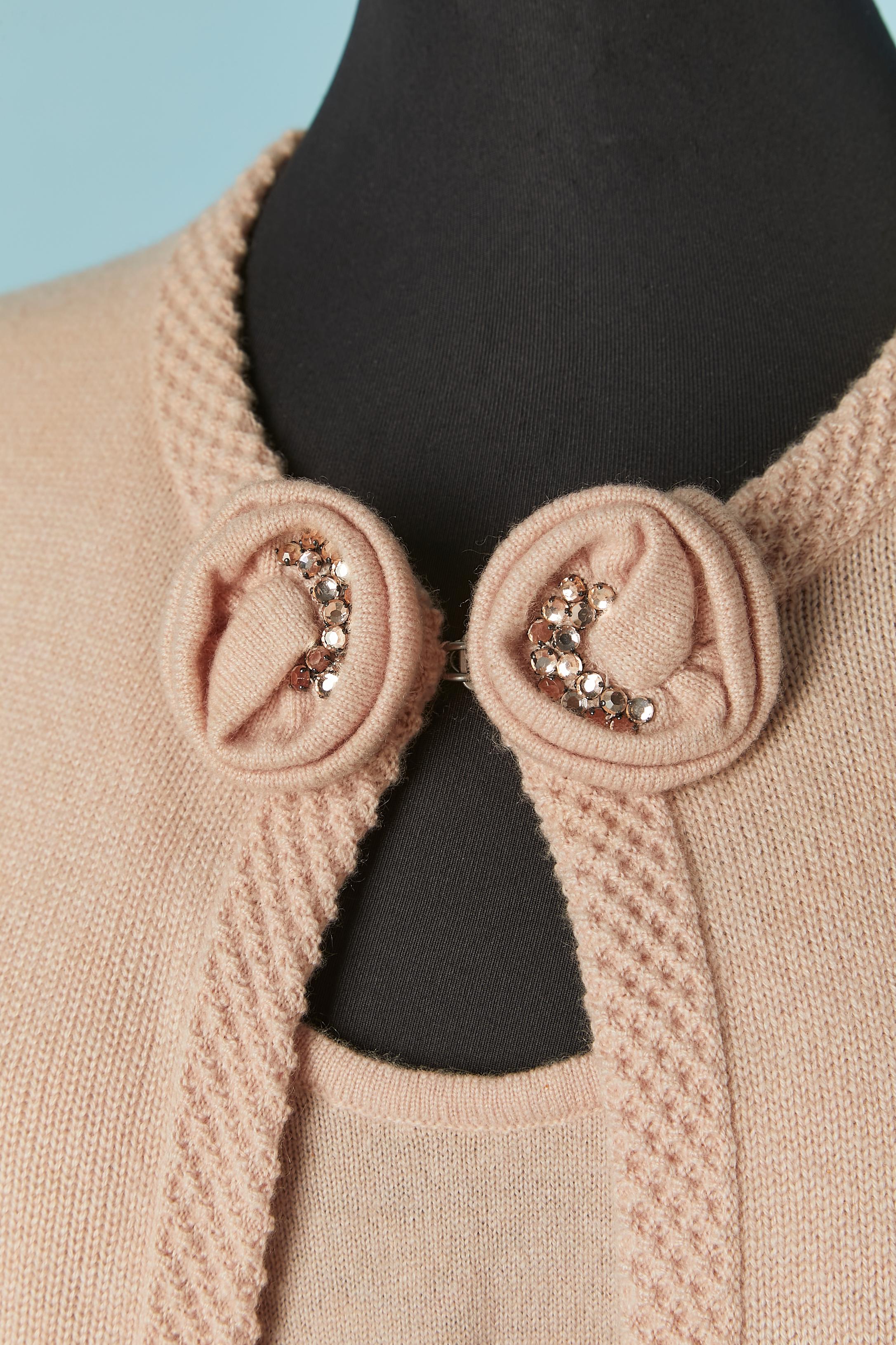 Pale pink cashmere with knit and rhinestone flower. Hook and eye closure on the top middle front. 
Pocket on both side. 
SIZE 46/ L 