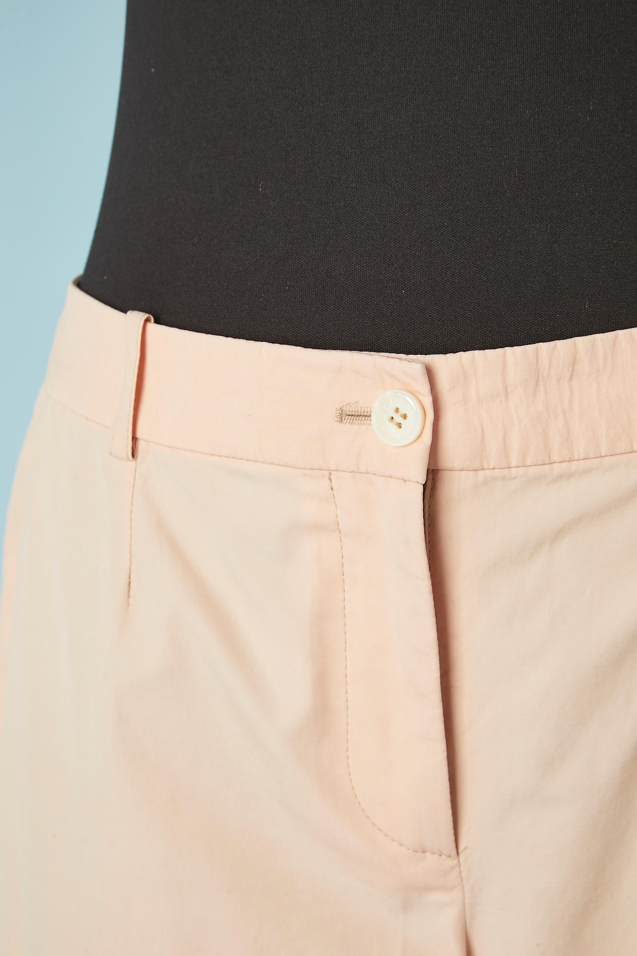 Pale pink cotton trousers. Zip and branded button closure in the top middle front. Belt-loop. Top-stitched bottom edge of each legs. 
SIZE 38 (Fr) 8 (Us) M 