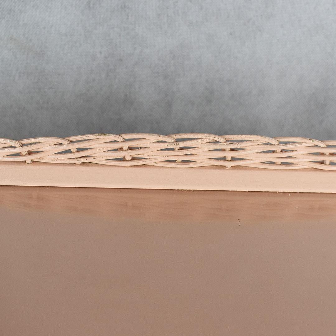Pale pink bamboo and wood breakfast or bed tray. A fantastic piece with a removable wicker tray with wicker handles. The tray has glass on top to shield the wood and make cleaning easy. Braided wicker outlines the exterior around the glass. At the