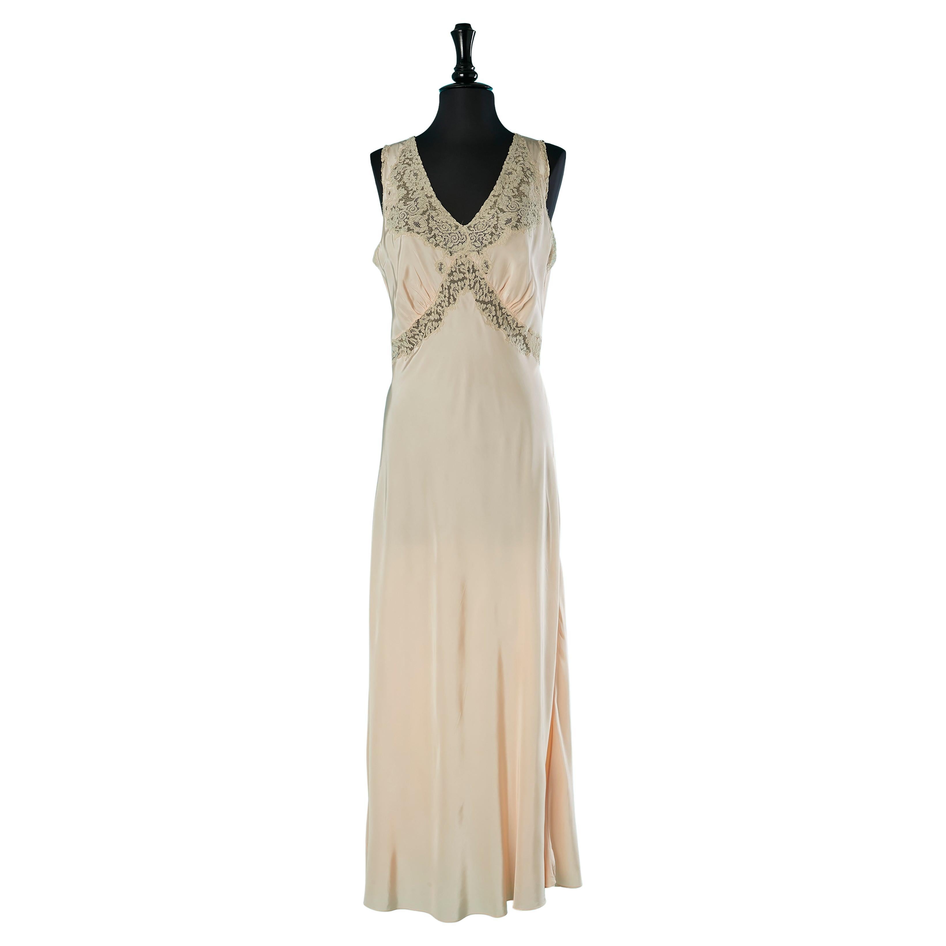 Pale pink rayon nightgown with lace inset Circa 1930
s