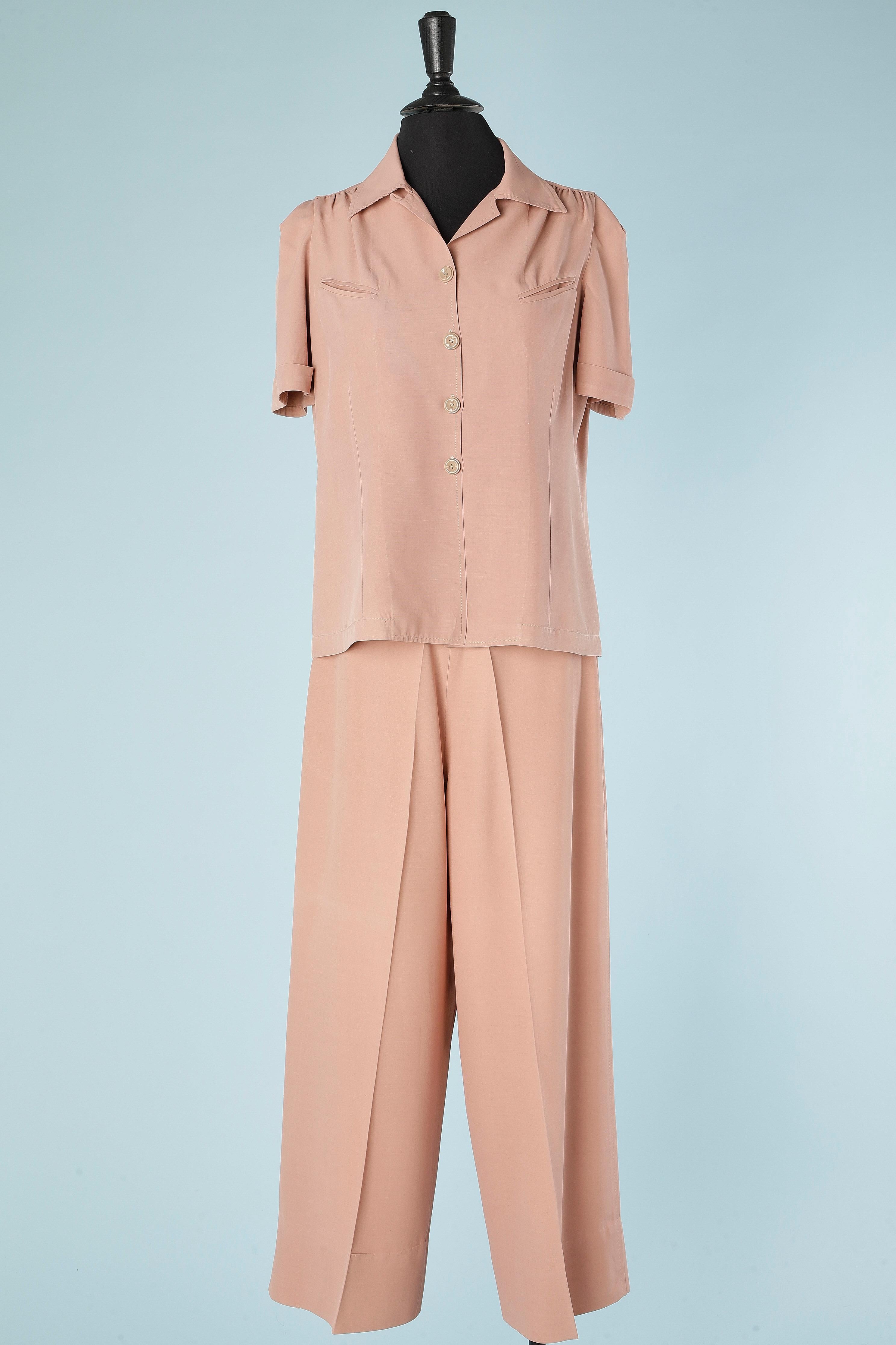 Pale pink rayon shirt and trouser ensemble. Belt-loop on the pant waist. 
Size L (shirt) and M (trouser) 