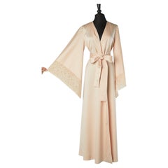 Pale pink satin deshabillé with lace on the sleeve edge