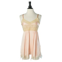 Pale pink short silk slip dress with lace inset and tulle edge Circa 1920
s