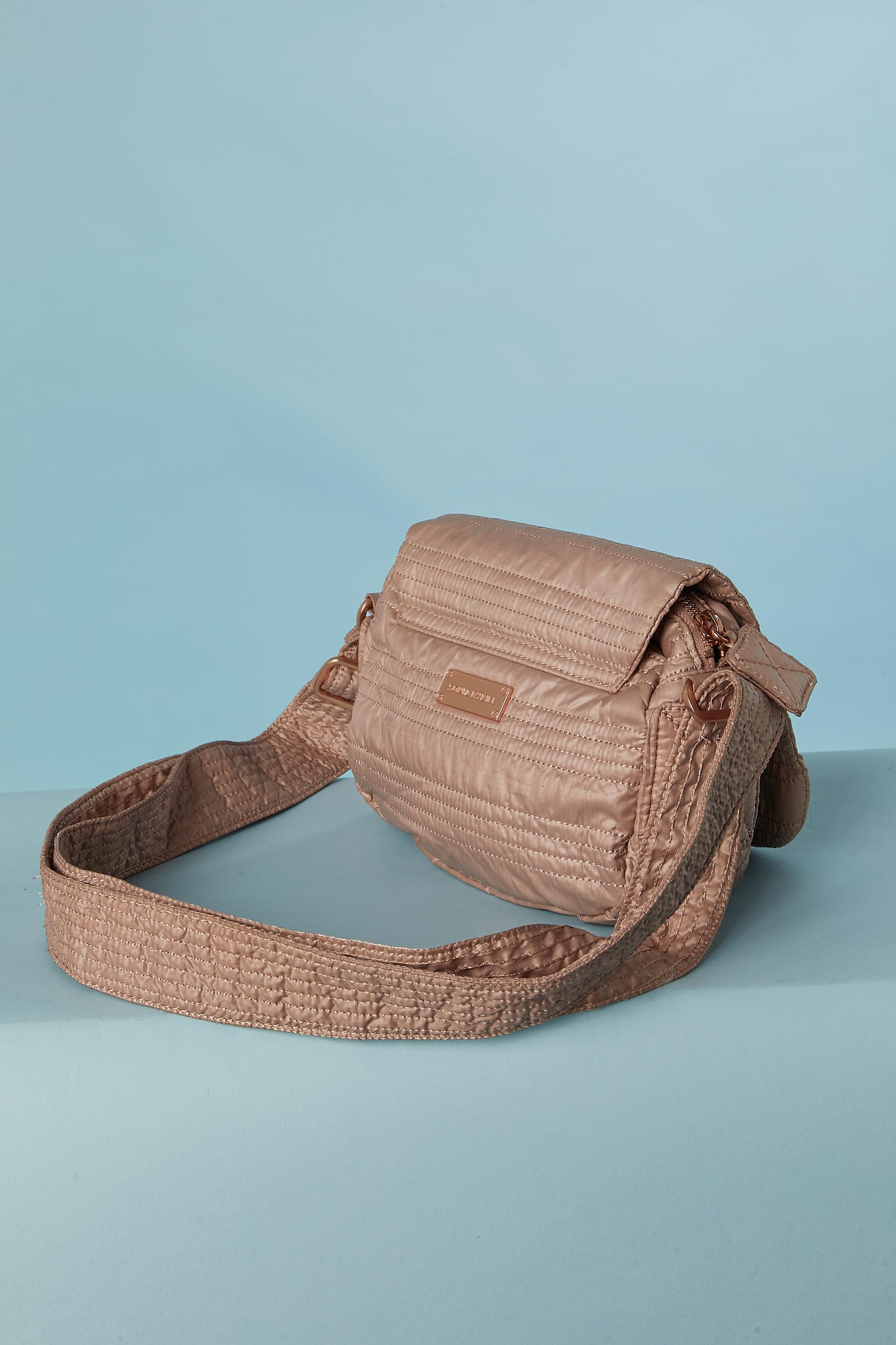 Pale pink top-stitched fabric bag. Fabric composition and lining: polyester. 
Snap closure under the flap and pocket under the flap with snap closure. Zip closure on the top ( under the flap) Mirror under the flap. One inside pocket with zip
