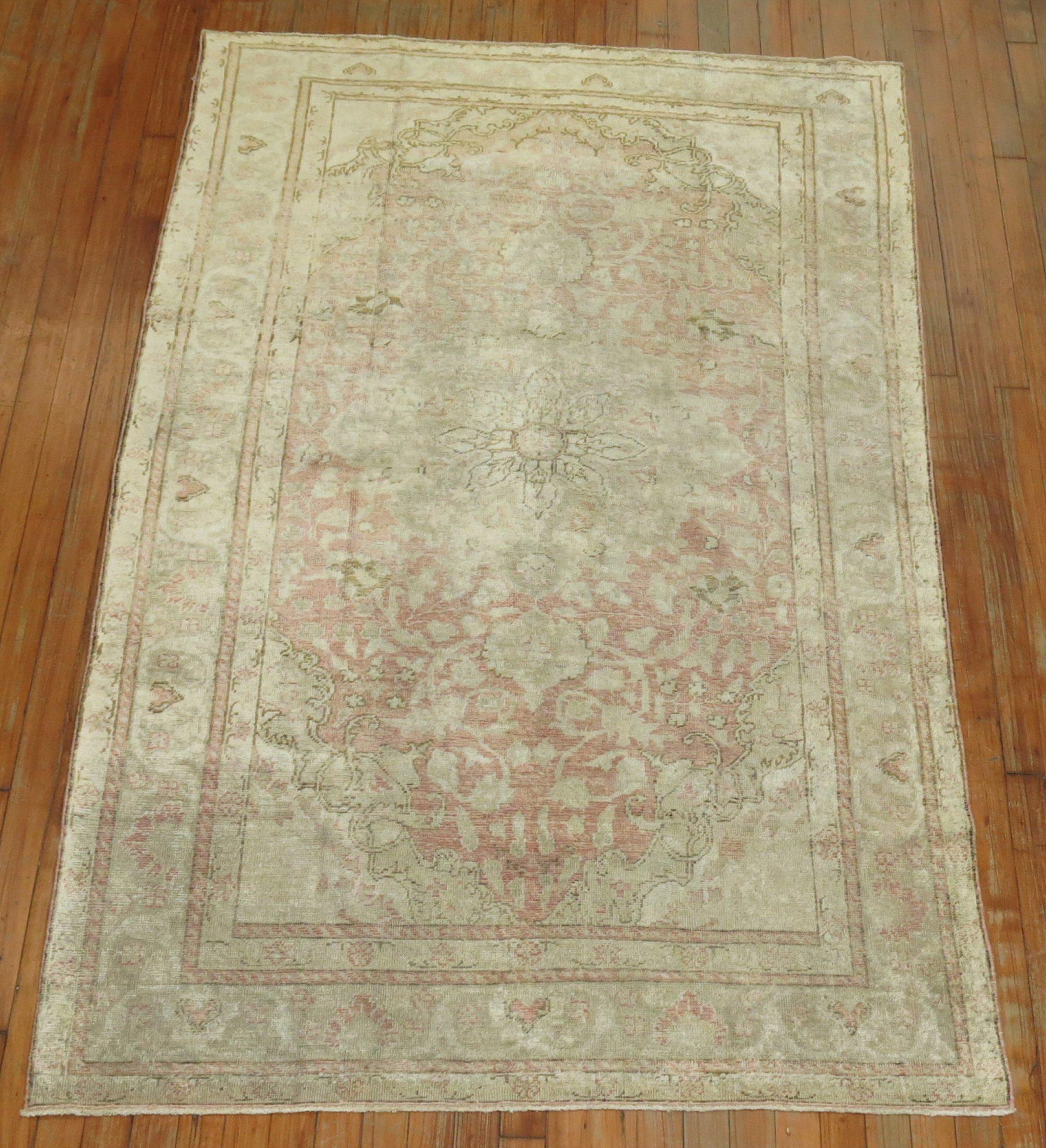 Accent size city weave Turkish rug in a predominant Pale Pink Tone. It has a formal and feminine feel to it. Measures: 4'2'' x 6'7''.
