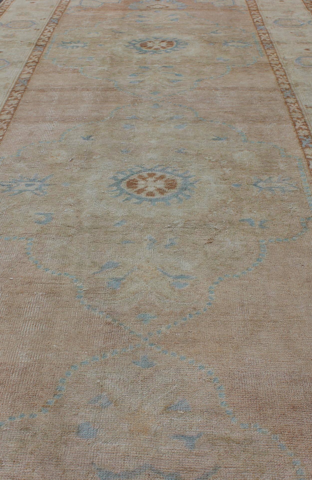 Mid-20th Century Pale Pink, Light Blue and Ivory Vintage Turkish Oushak Runner For Sale