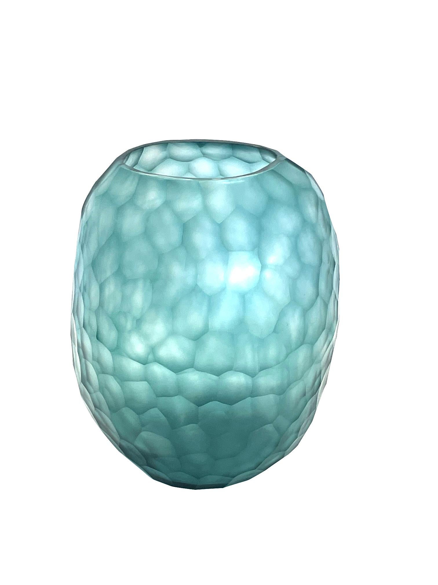 Contemporary Romanian pale turquoise glass vase.
All over beveled design.
Can hold water.
Part of a large collection.