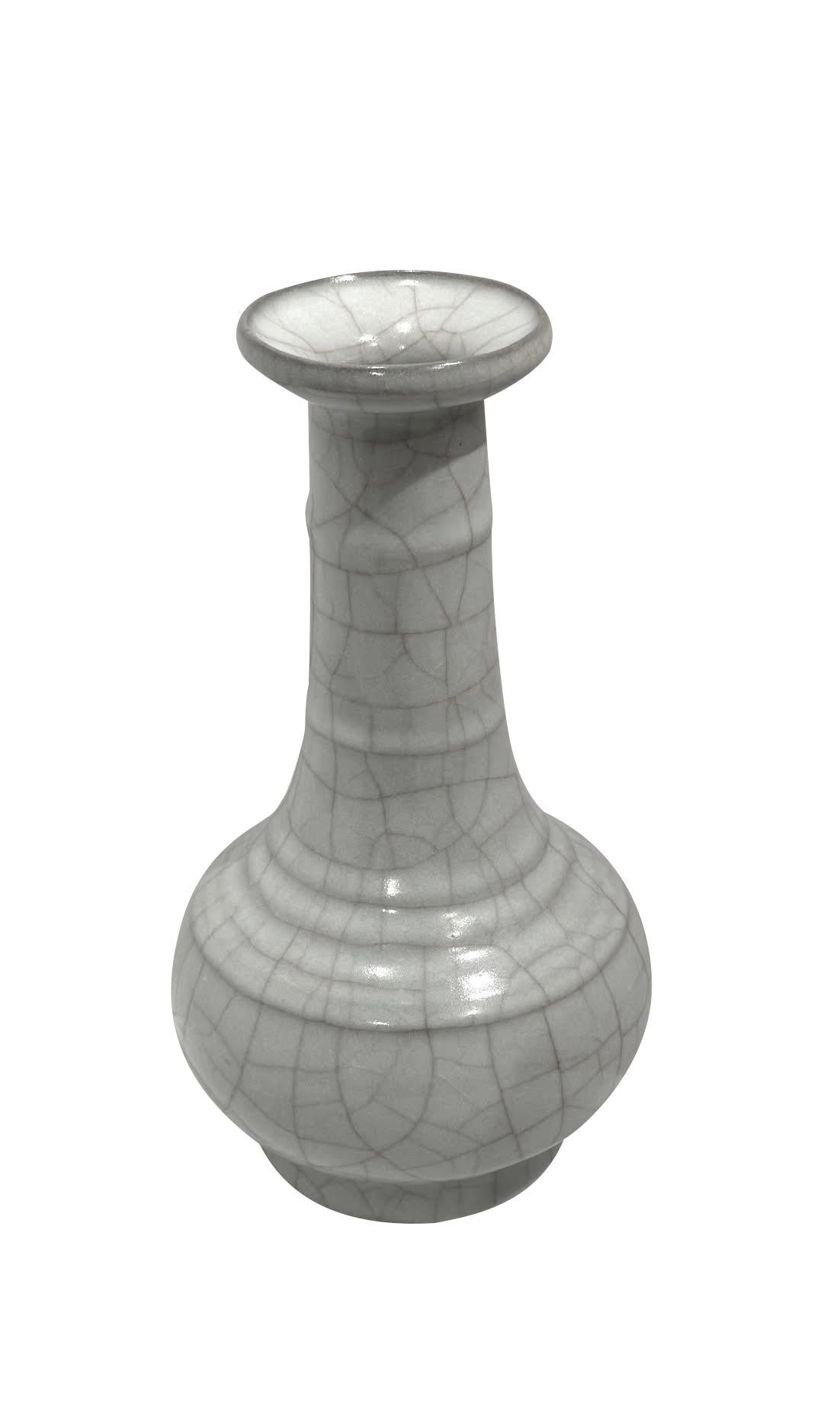 Vase contemporain chinois de couleur turquoise pâle.
Glace craquelée contrastée.
Col entonnoir avec détails en côtes.
Un exemplaire parmi d'autres d'une grande collection.

