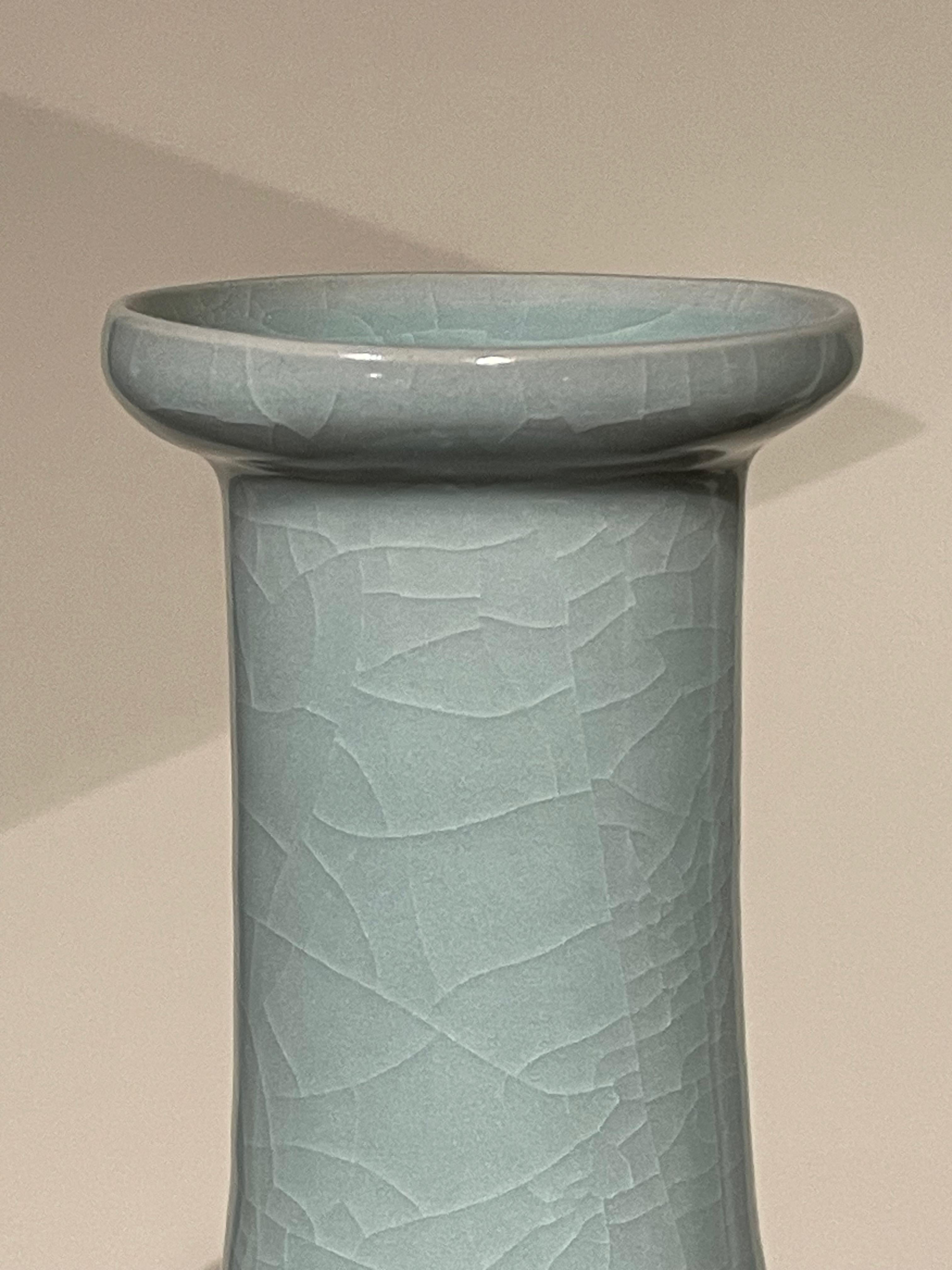Contemporary Chinese pale turquoise vase.
Elongated neck with ribbed detail at opening.
Large collection available with varying sizes and shapes.
Sold individually.
ARRIVING APRIL