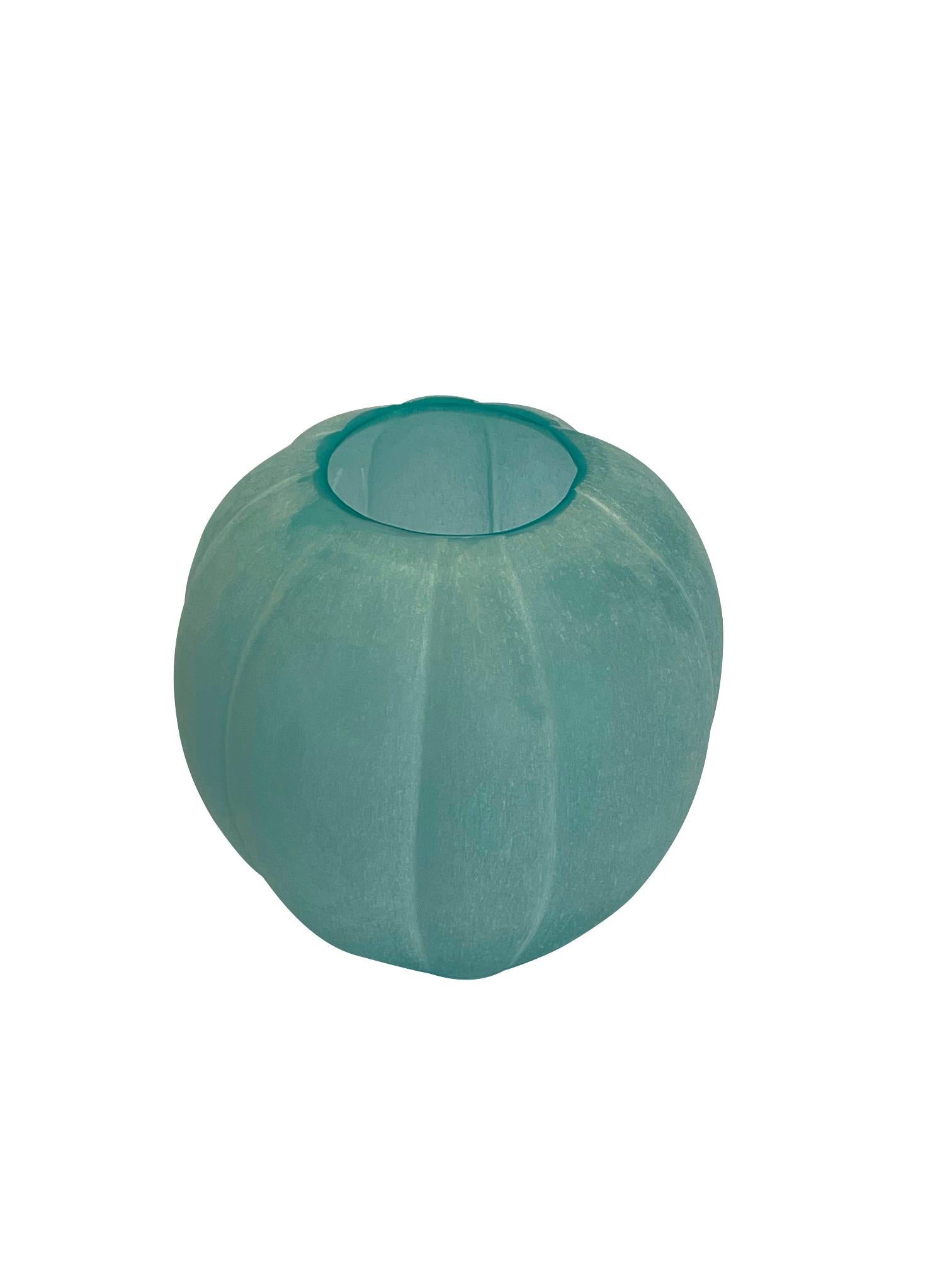 Contemporary Romanian pale turquoise frosted glass vase.
Multi sided and pumpkin shaped.
Can hold water
Part of a large collection