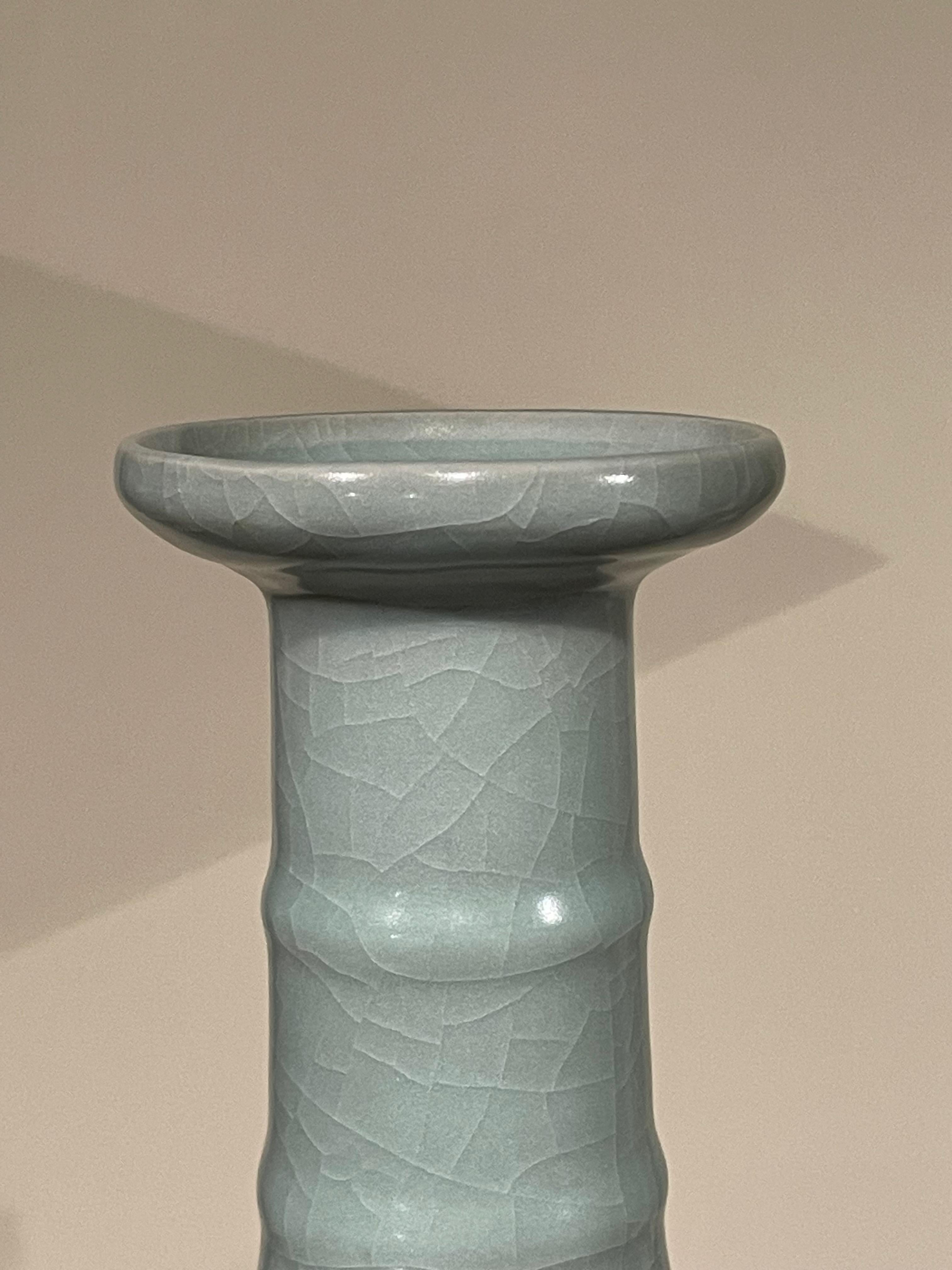 Contemporary Chinese pale turquoise vase.
Tall neck with horizontal rib details.
Large collection available with varying sizes and shapes.
ARRIVING APRIL