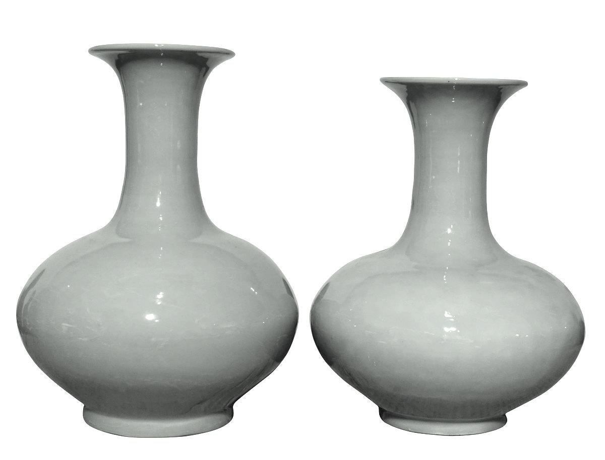 Contemporary Chinese collection of clear pale turquoise glazed vases in Classic shapes.
Size range 5 inches diameter x 7.5
