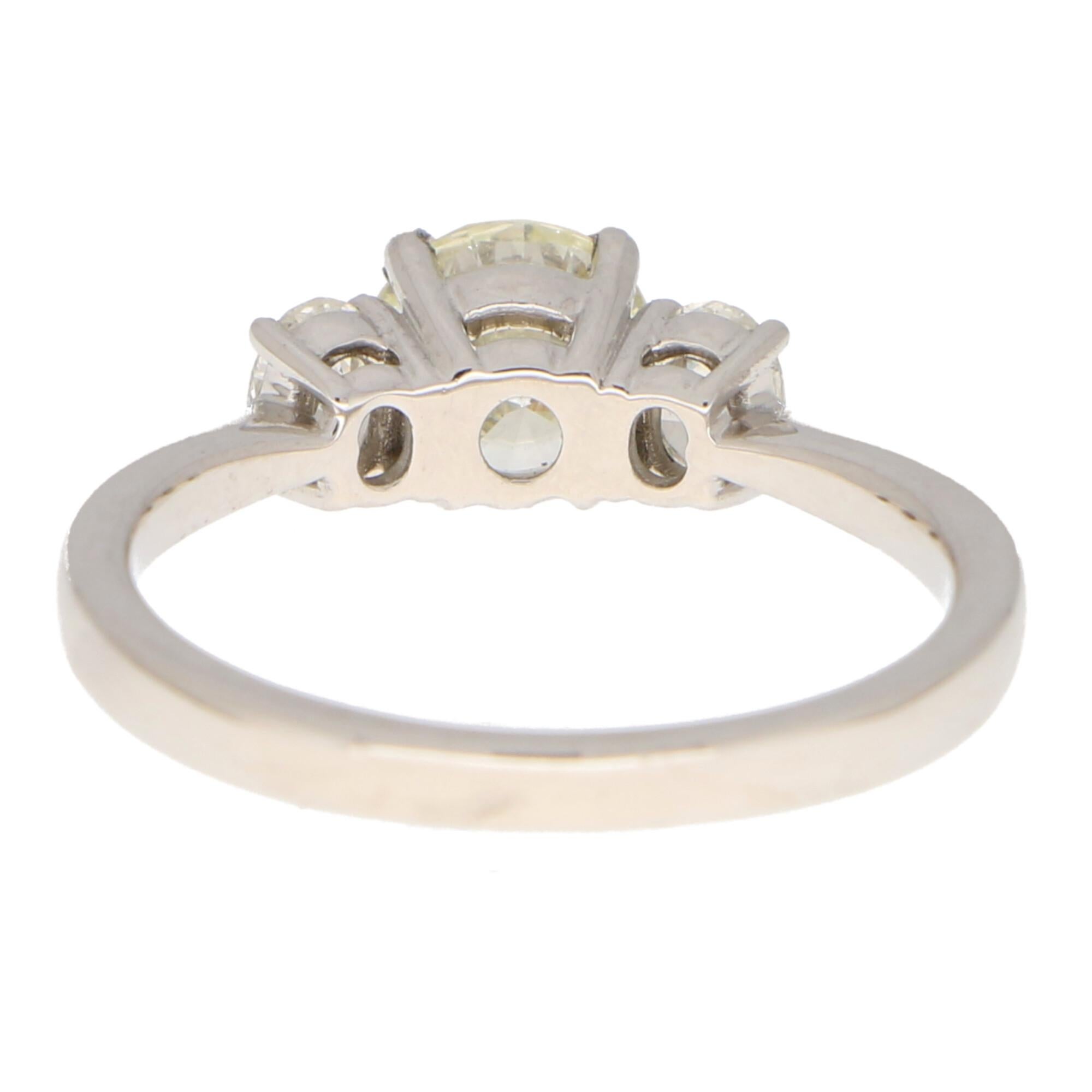 Round Cut Pale Yellow Diamond Three Stone Engagement Ring Set in 18k White Gold