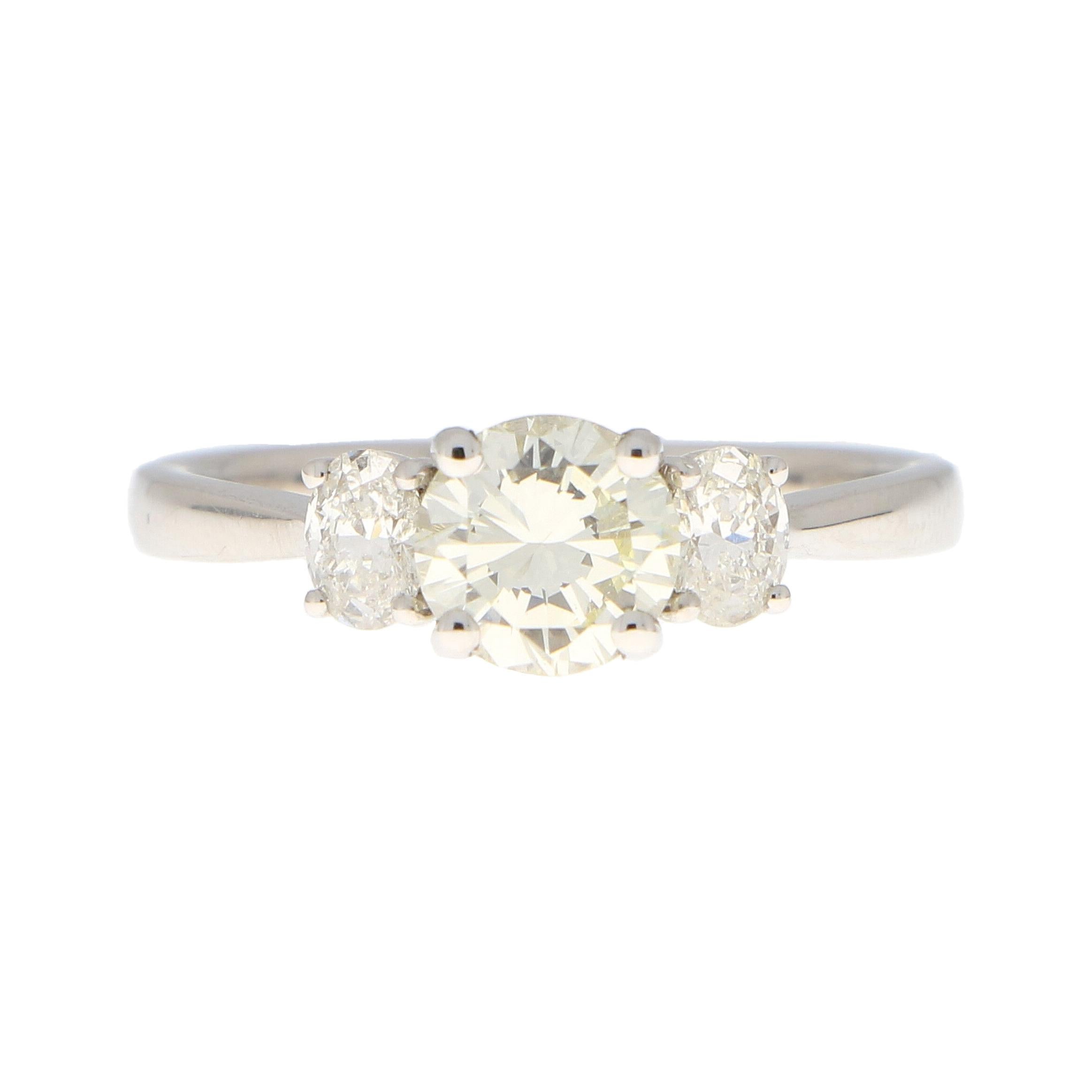 Pale Yellow Diamond Three Stone Engagement Ring Set in 18k White Gold