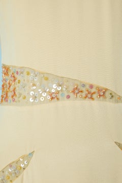 Pale yellow evening dress with tulle, beads and sequin inset Lorena Sarbu