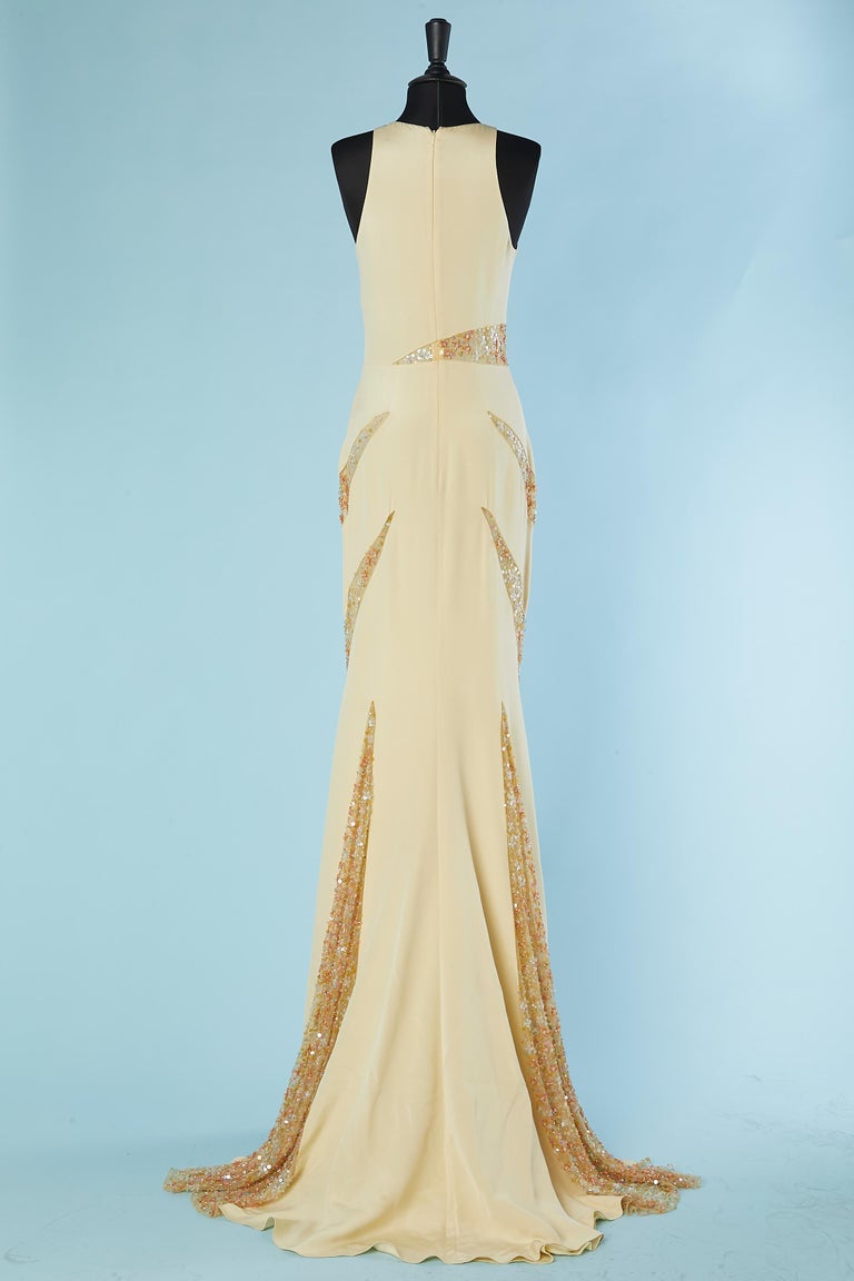 Pale yellow evening dress with tulle, beads and sequin inset Lorena Sarbu
