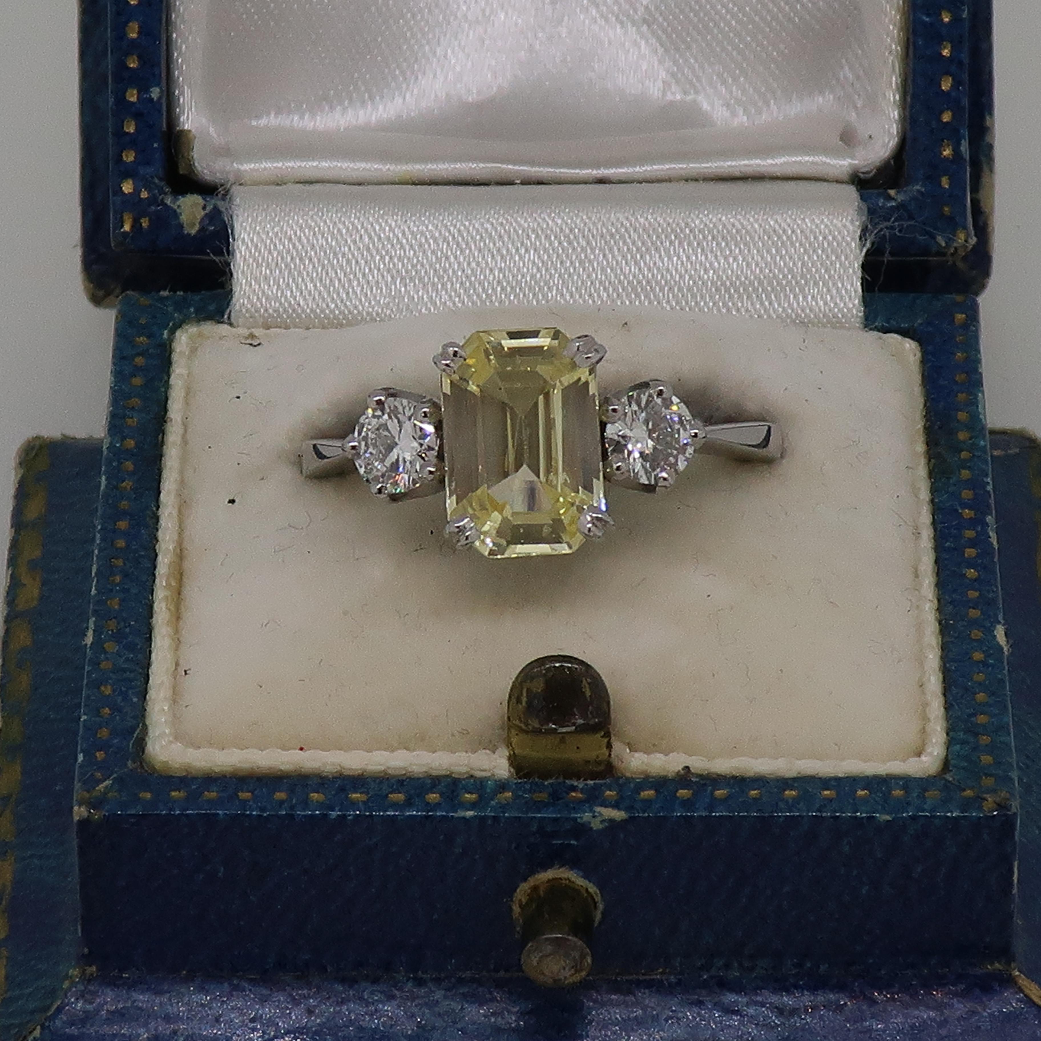 Emerald Cut Pale Yellow Sapphire and Diamond Three-Stone Ring 18 Karat White Gold For Sale