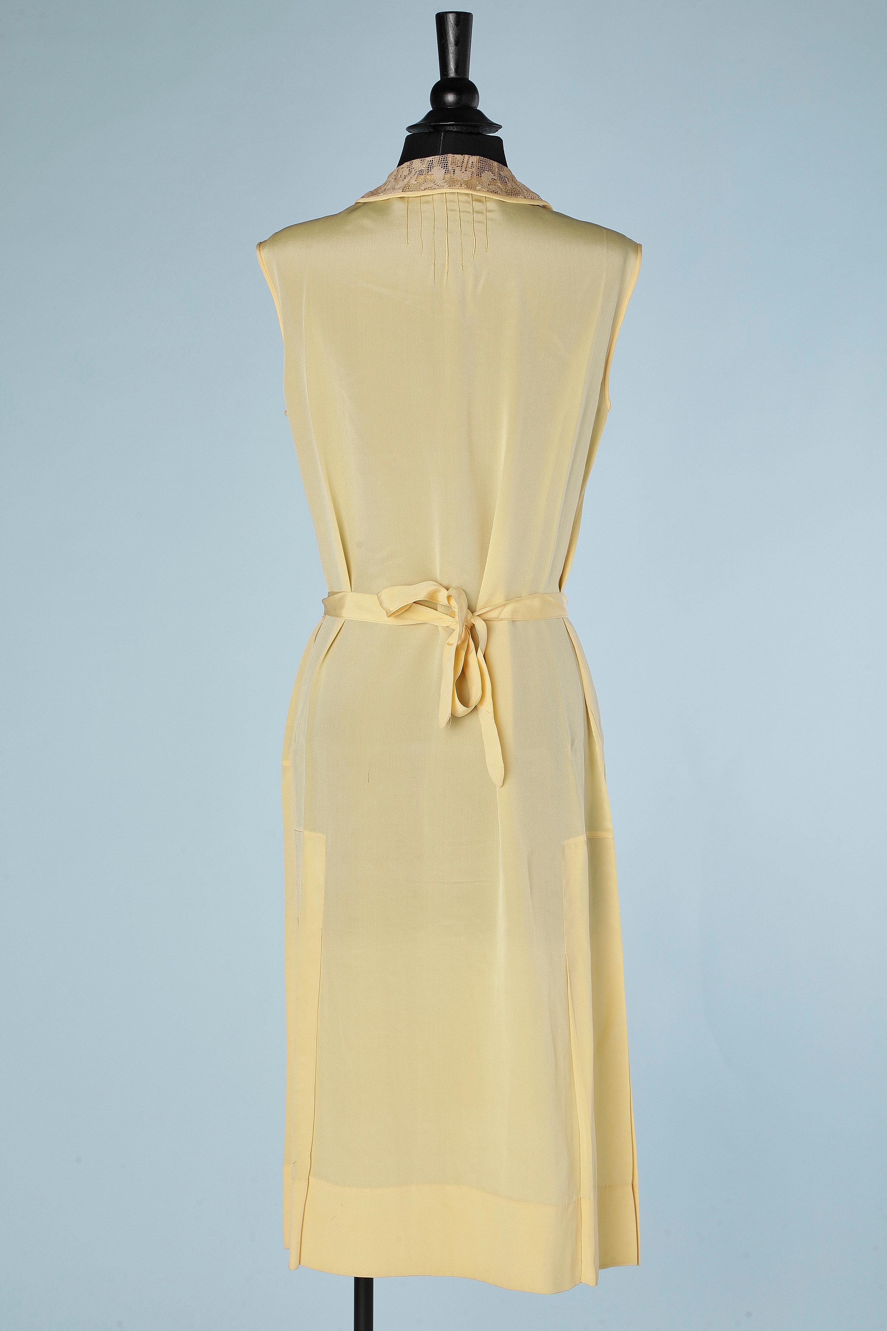 White Pale yellow silk dress with lace appliqué and ivory silk thread Circa 1920