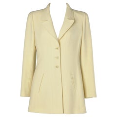 Pale yellow wool single breasted jacket with branded buttons Chanel Boutique