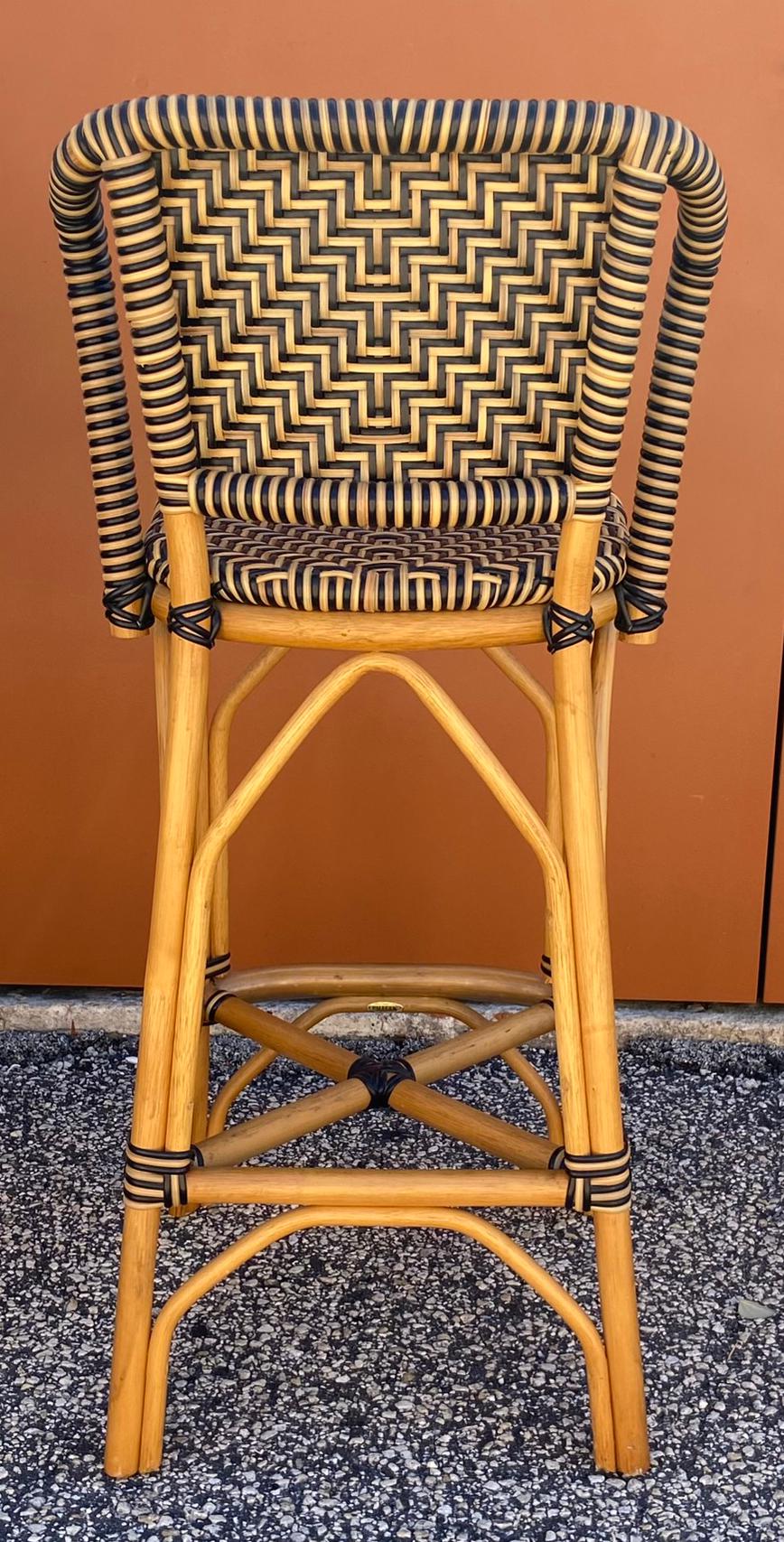 Set of four Palecek rattan bar stools French country style with multicolored plastic wraps. In very good original condition marked Palecek. 
      41 1/2 inches high 19 inches deep 18 inches wide seat height 30 1/2 inches 