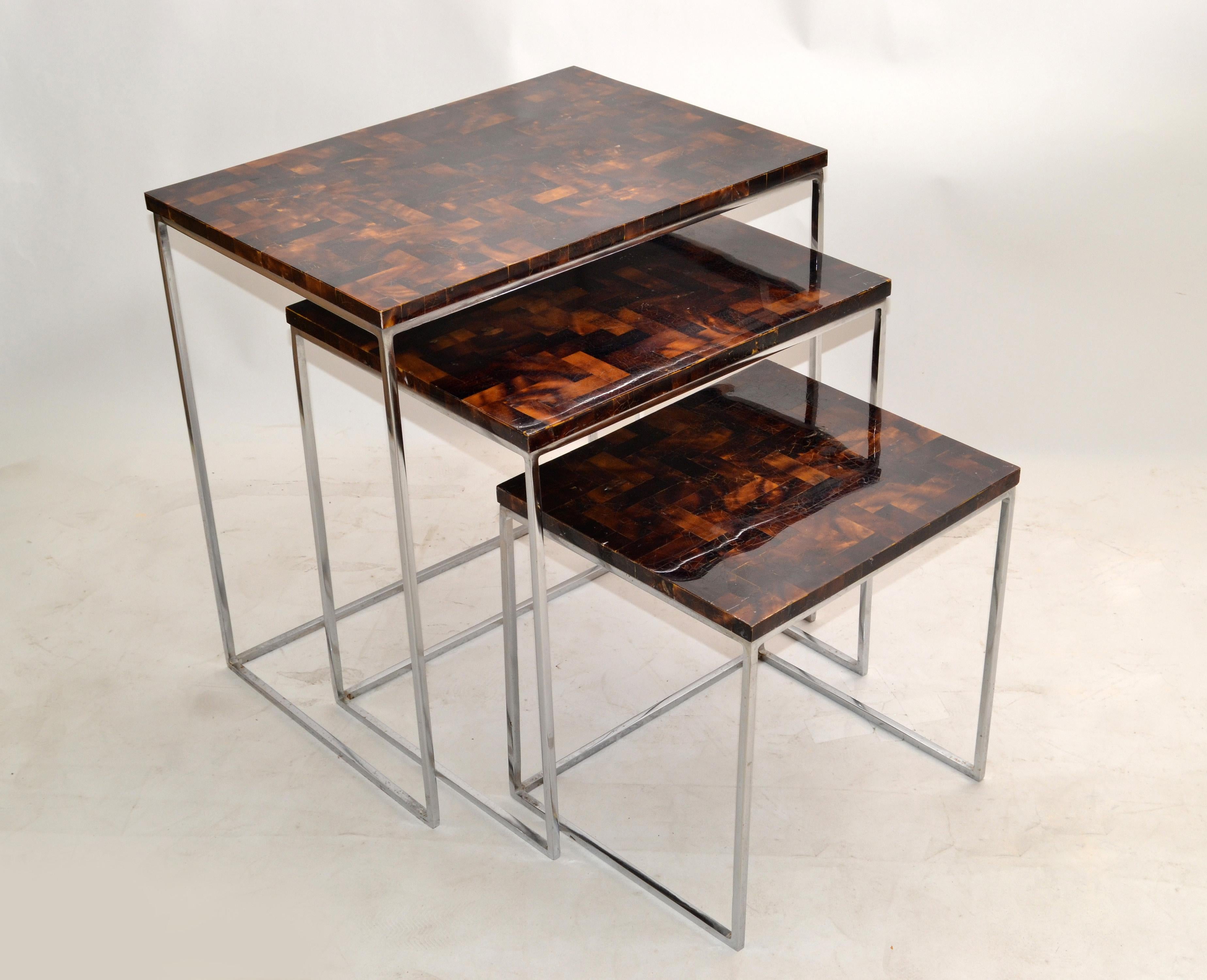 Asian modern chrome & handcrafted fossilized coconut top set of 3 nesting tables or stacking tables made by Palecek Furniture in the Philippines.
Restored condition and ready for a new Home.
Size of each table:
17.25 D x 24.25 L x 24.75 inches