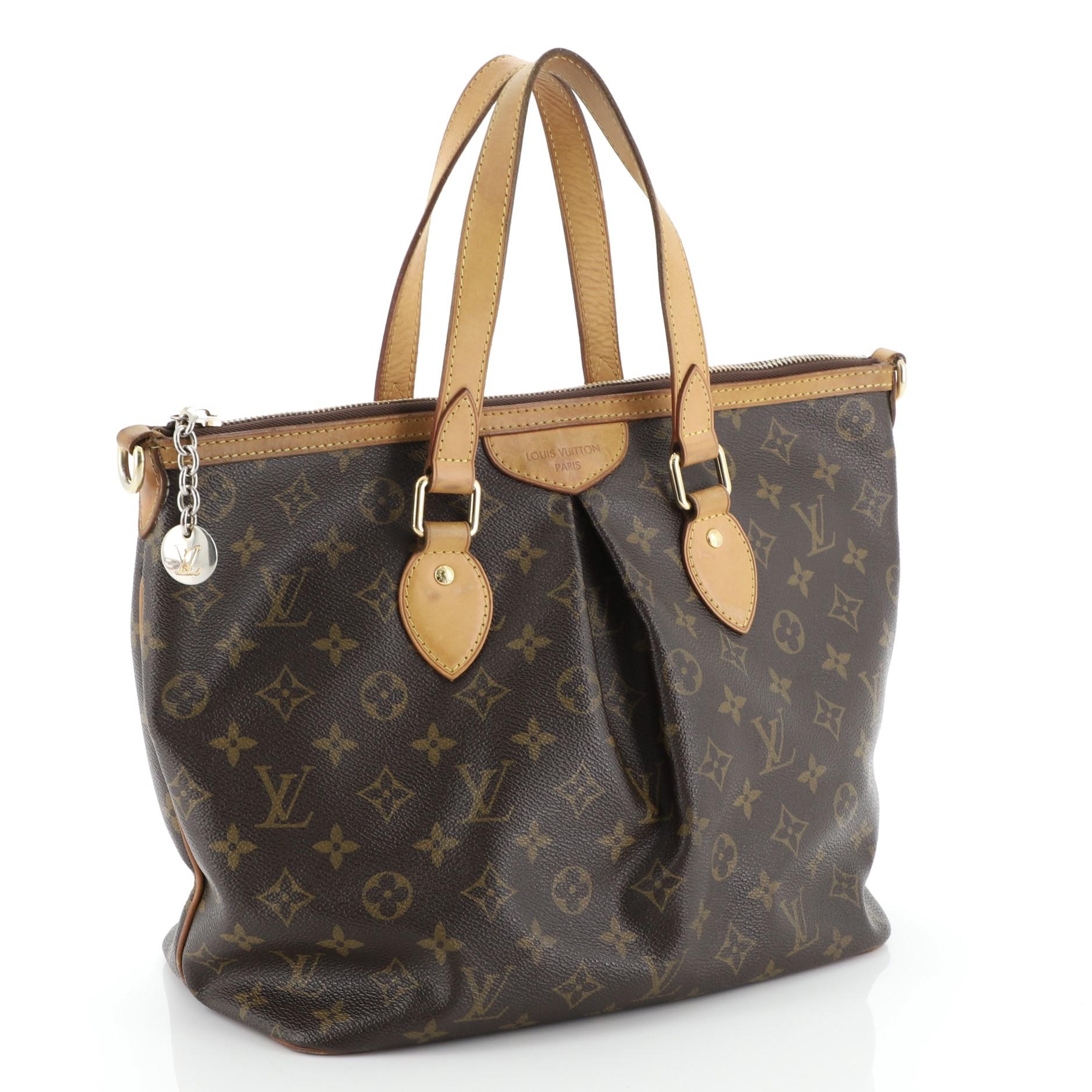 This Louis Vuitton Palermo Handbag Monogram Canvas PM, crafted from brown monogram coated canvas, features dual flat leather handles, vachetta leather trim, pleated silhouette, and gold-tone hardware. Its zip closure opens to a brown fabric interior