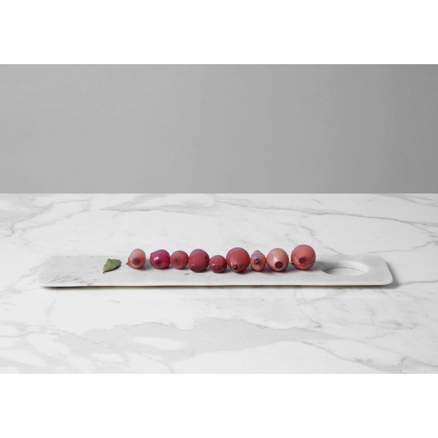 Paletta tray/chopping board by Studioformart
Total Marble Collection
Dimensions: 50 x 12 x 1 cm
Materials: Bianco Carrara 

The history of marble carving is lost in time; in one breath, it takes us back to the IV century BC, to ancient Greece