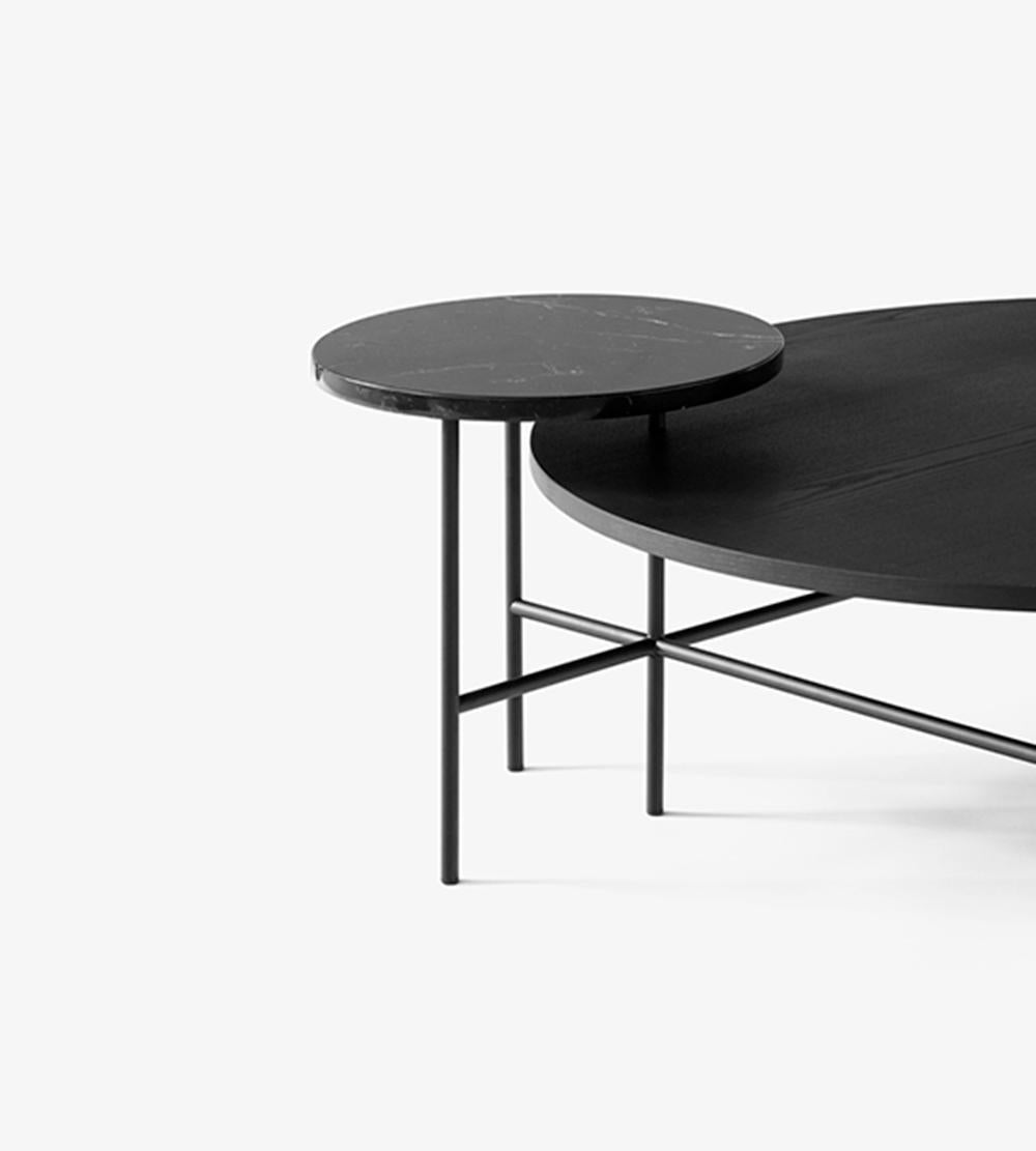Inspired by Alexander Calder’s kinetic sculptures, Spanish designer Jaime Hayon transformed the idea of a mobile into a table - stabilised by a metal armature. 
The base is made from welded and powder coated steel tubes. The table tops are made