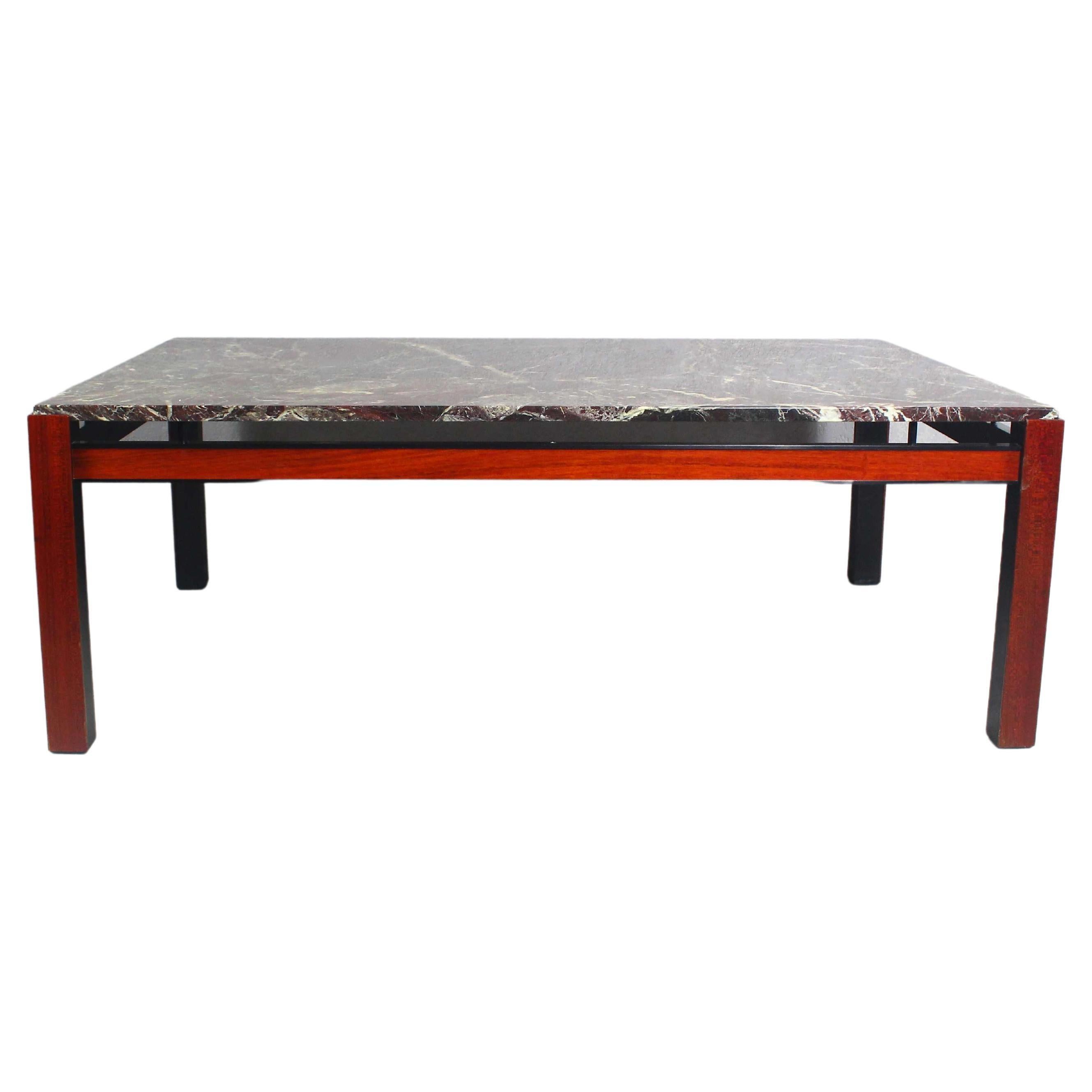 Beautiful, long coffe table with marble.
Frame decorated with rosewood panels.
 