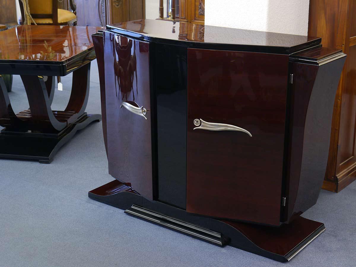 Original French two-door Art Deco sideboard around 1930 elaborately lacquered.
The curved foot in combination with the exceptionally curved shaped side panels adds to the visual value of this piece of furniture.
The grain and color of the
