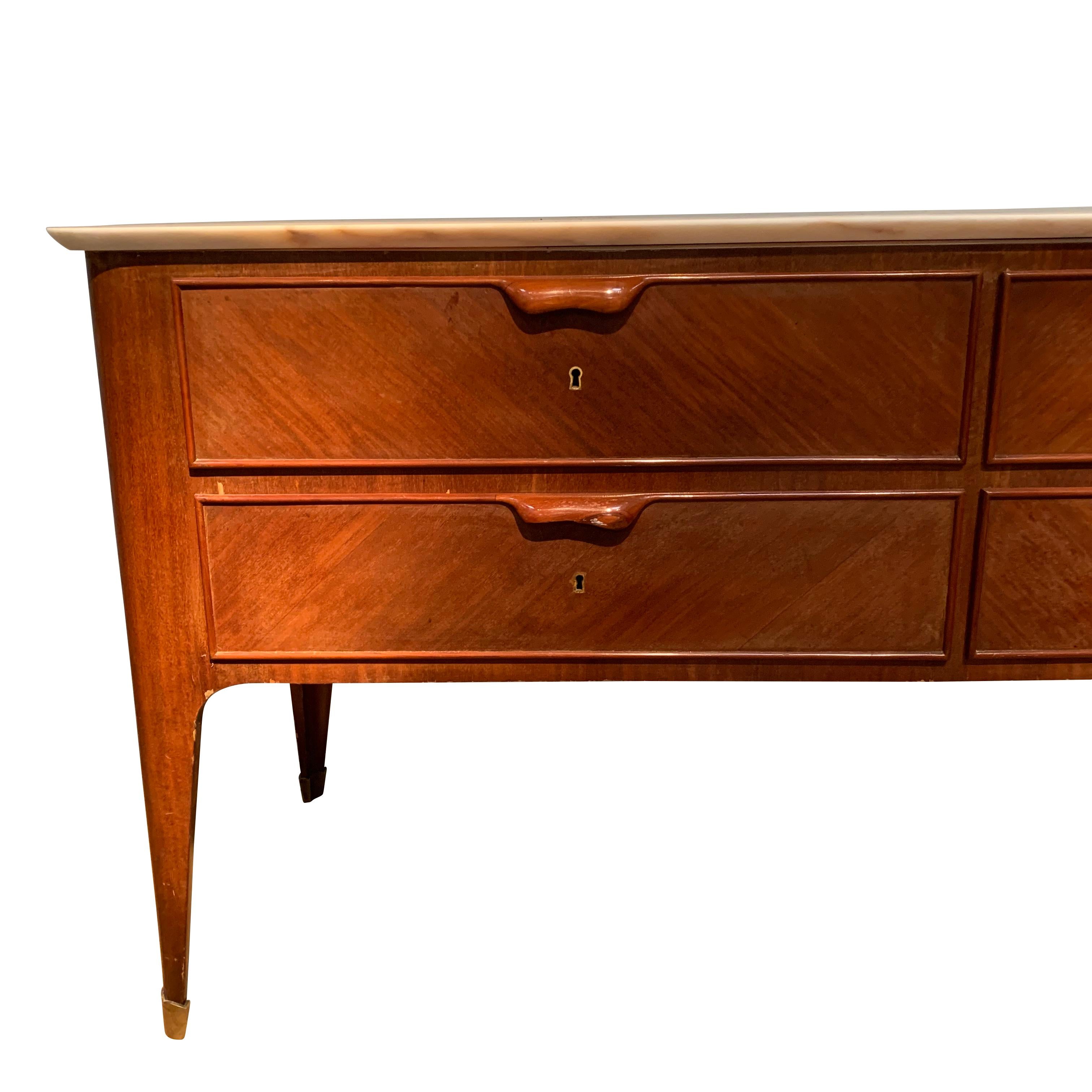 1940s Italian credenza designed by Paolo Buffa one of the most infuential architects and furniture designers of the 20th century.
This designer uses palisander wood topped by marble to create a streamlined and elegant credenza. 
Palisander handles